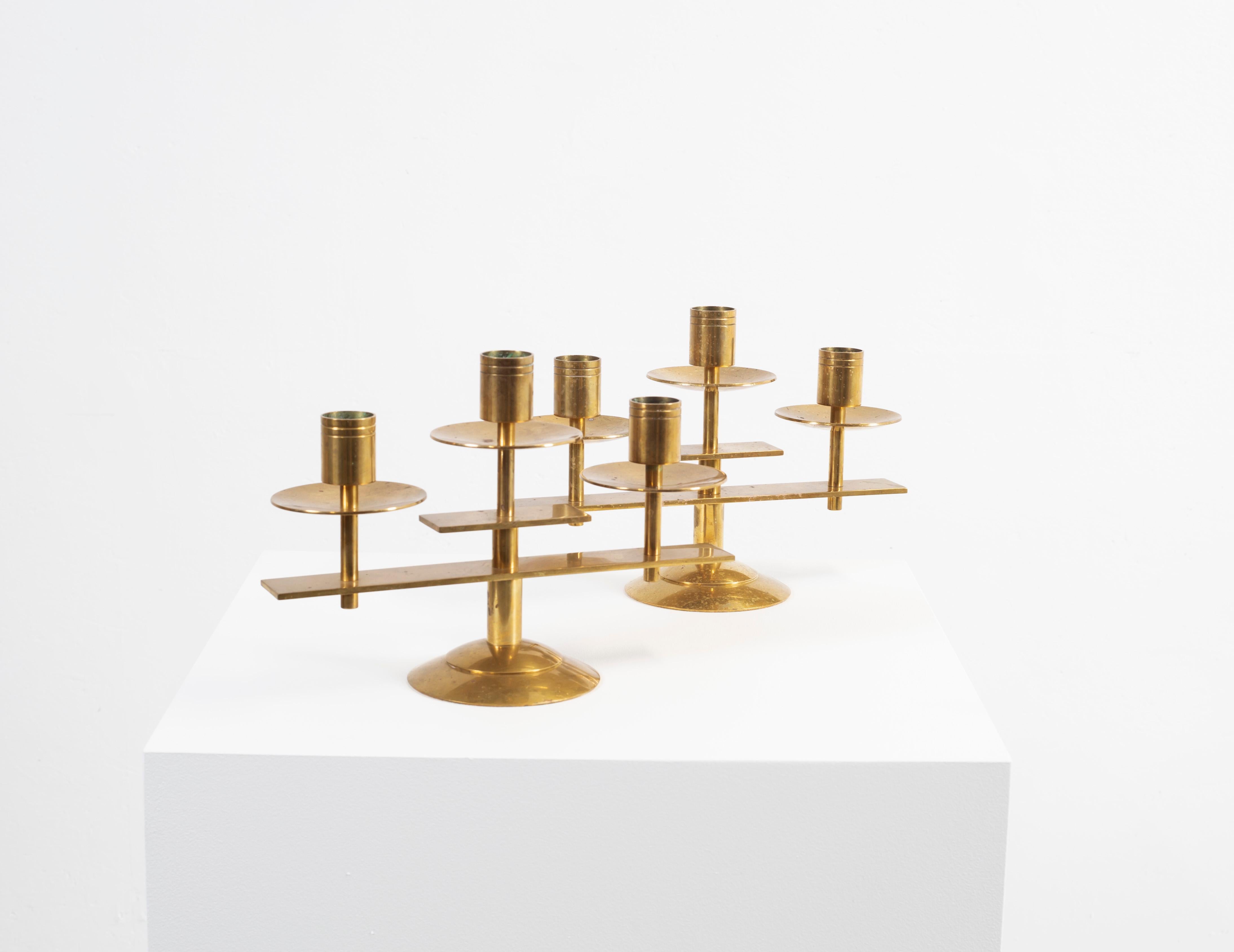 Wonderful, modern and subtile candleholders in brass. Designed and made in Denmark from circa 1960s second half.
