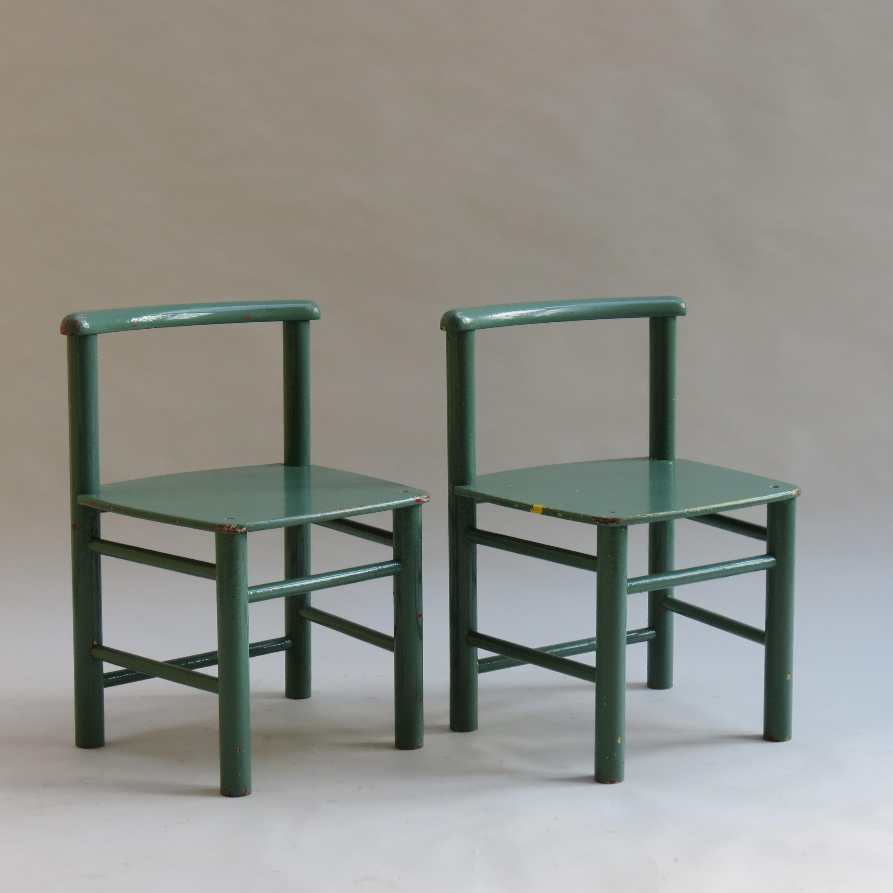 Pair of Scandinavian child’s chairs that date from the 1960s. Made from pine and plywood. They have both been overpainted, some time ago, they were originally red, then yellow and are now green. The paint is nicely distressed revealing the chairs’