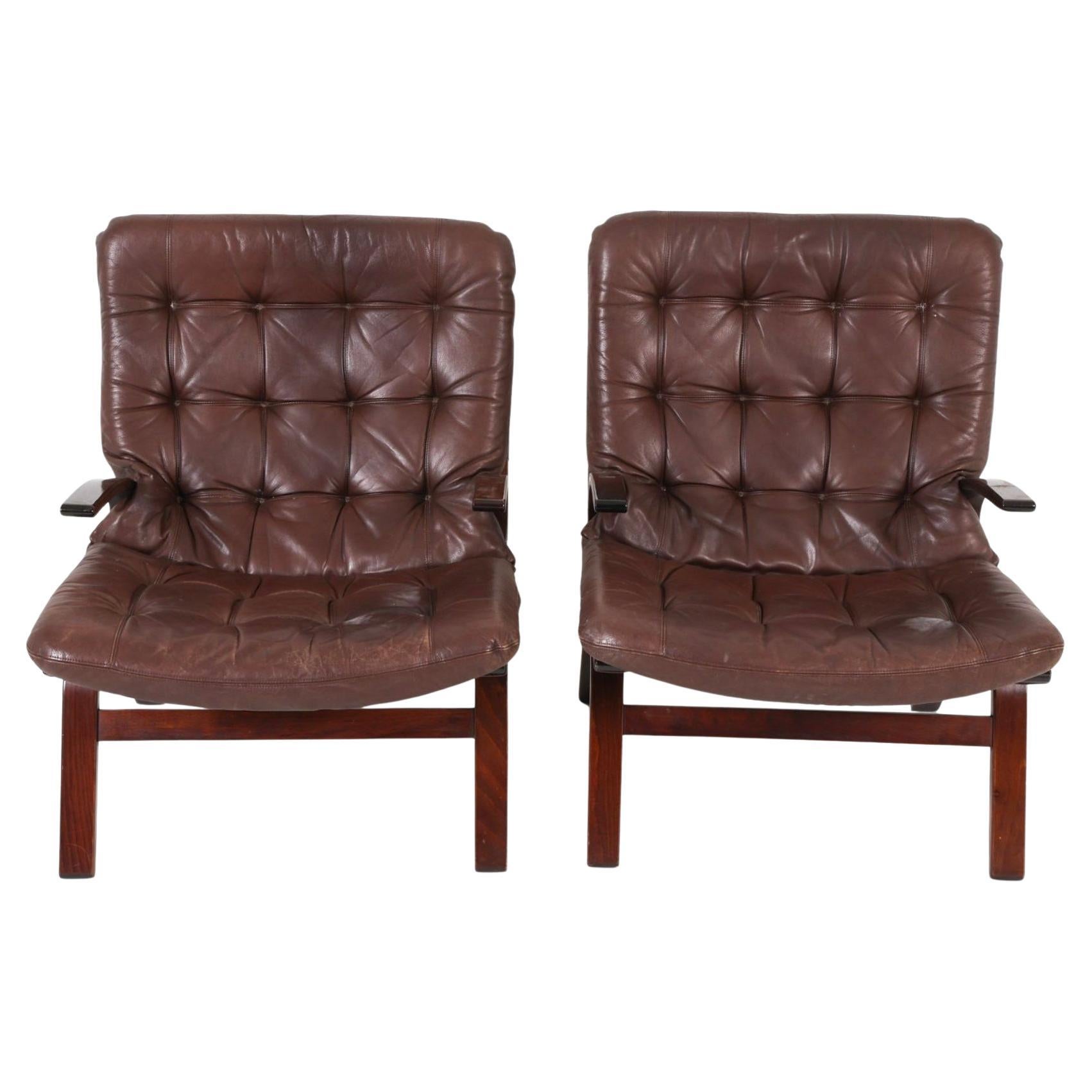 Pair of Scandinavian Dark Brown Leather and Curved wood lounge chairs