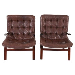 Pair of Scandinavian Dark Brown Leather and Curved wood lounge chairs