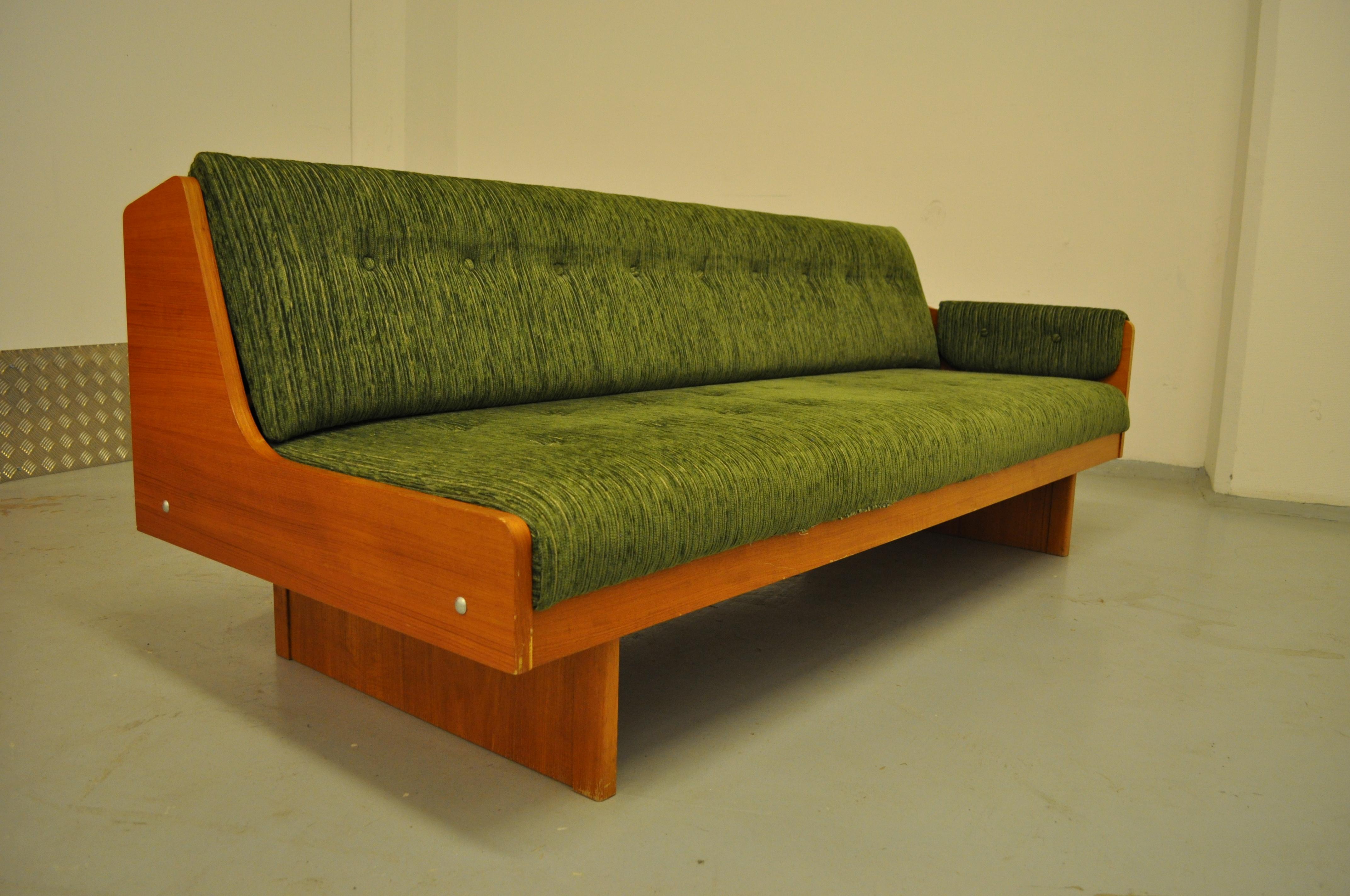 Pair of Scandinavian sofa beds in teak and velvet fleeces based on a modernist base that seems to make the seat levitate. The back of each sofa can be raise to make room for a bench / bed, its original sheet and quilt.