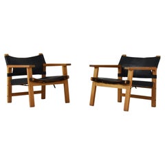 Pair of Scandinavian Easy Chairs in Oak and Black Leather Dating from the 1960’s