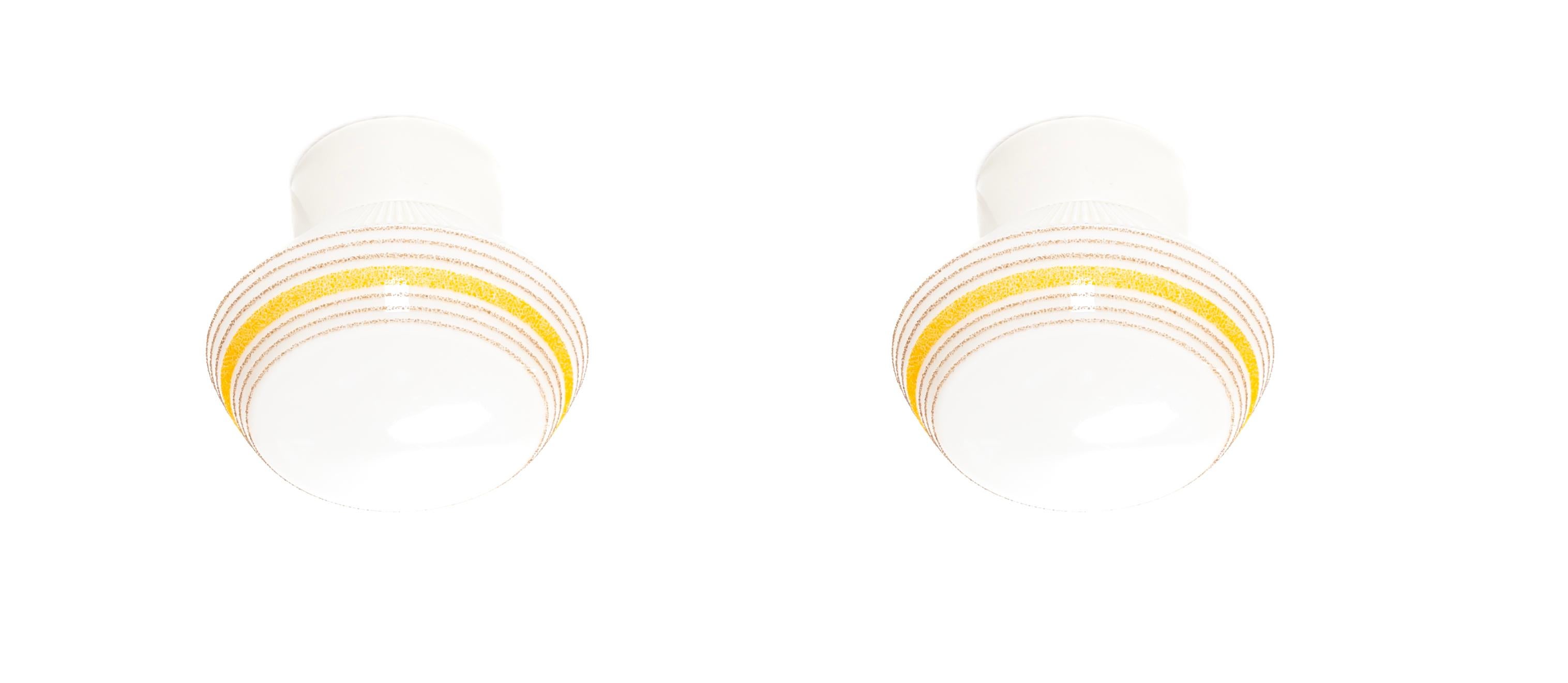 Wonderful pair of ceiling lights on a porcelain base with shades in decorated opaline glass. Designed and made in Norway from circa 1950s first half by Høvik Lys. Both lamps are fully working and in good vintage condition. Each lamp utilize one E27