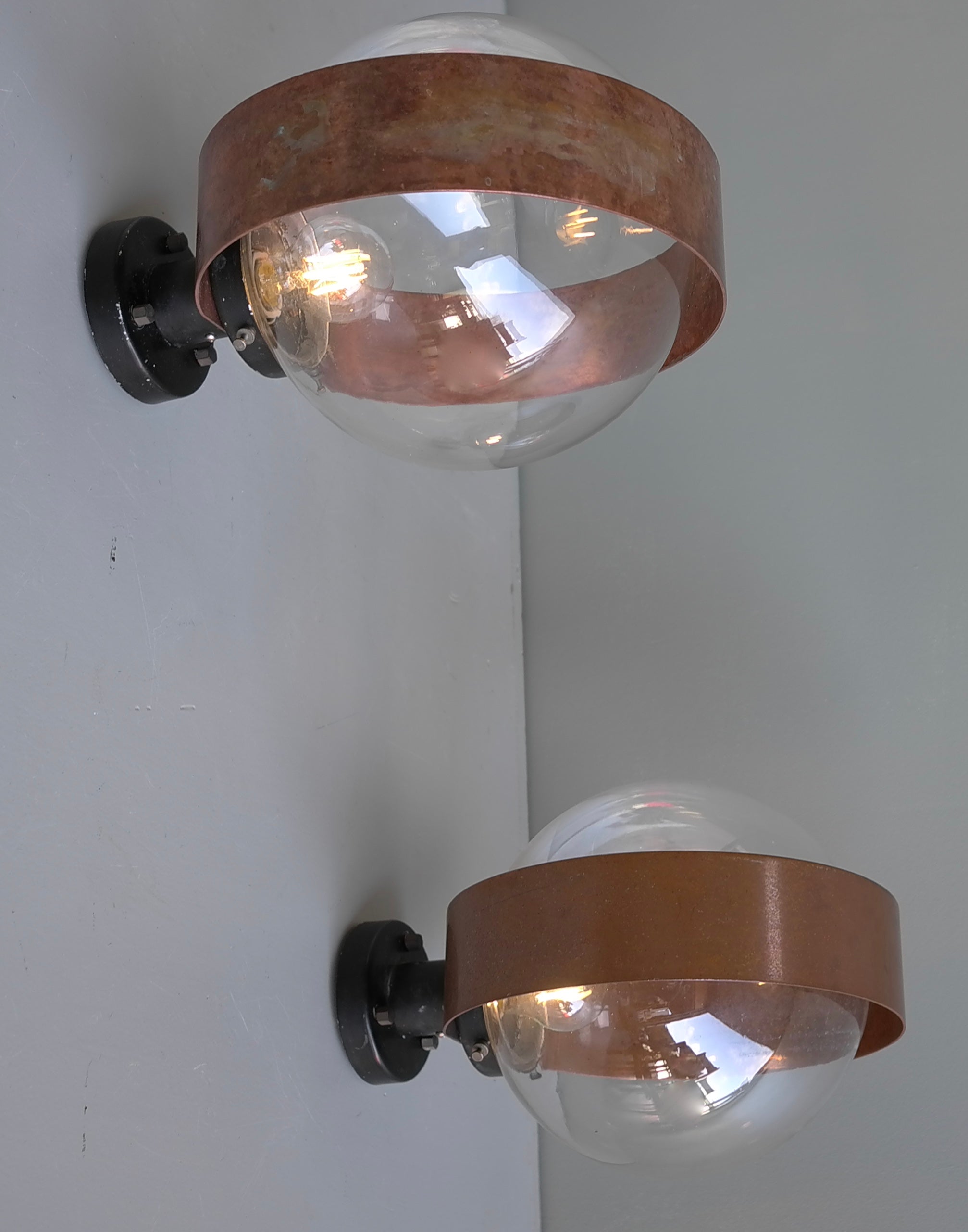 Pair of Scandinavian glass ball wall lamps with Copper Patina Rims, 1960's


These can also be used as a flushmount. Lovely patina to the Copper Rims.