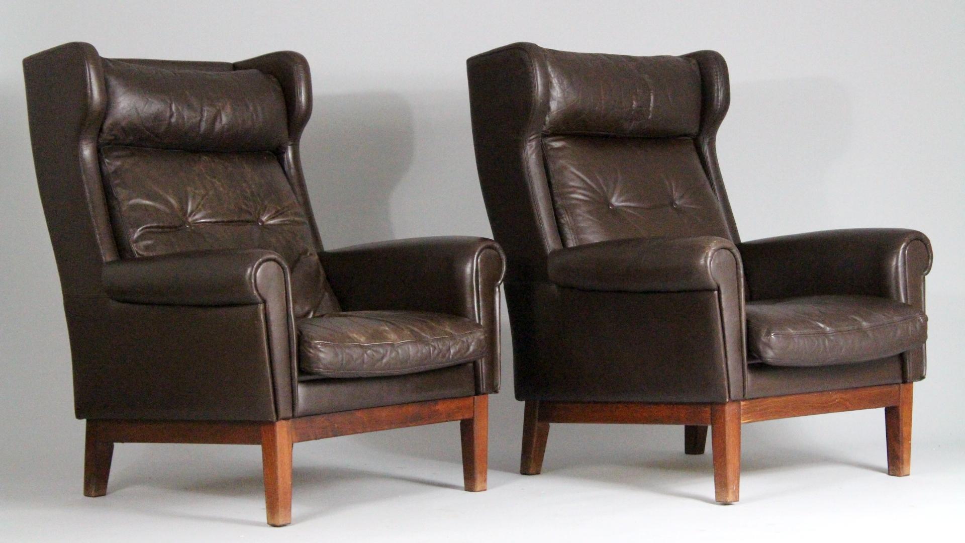 Pair of scandinavian club chairs with well worn original leather upholstery from the 1970s. Good original condition with nice patina.