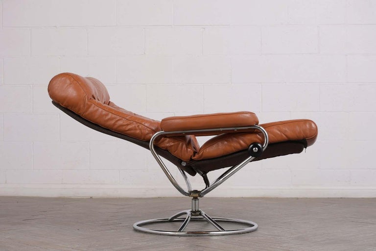Pair of Scandinavian Leather Swivel Reclining Lounge Chairs at 1stDibs