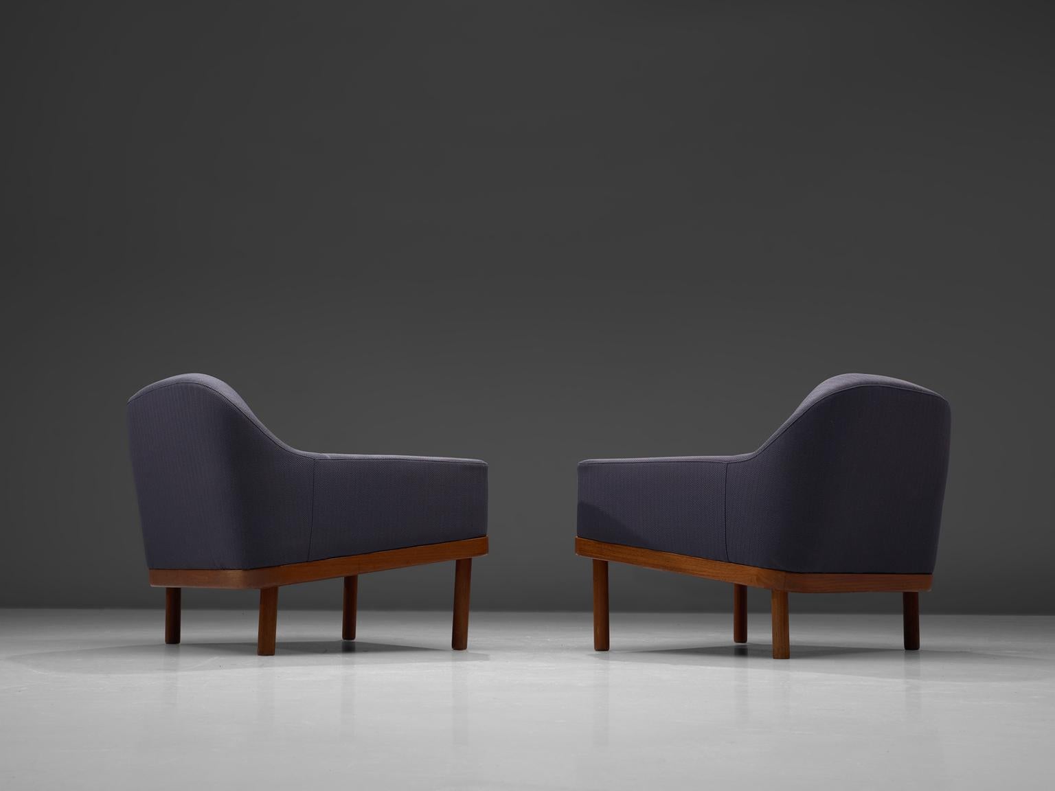 Set of two easy chairs, in teak and fabric, Scandinavia, 1960s. 

Beautifully designed Scandinavian lounge chairs. This design features is well-balanced in in curves and sharp corners.The top backrest flows over in a beautiful curve to the