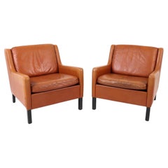 Pair of Scandinavian Mid Century modern Cognac Leather Low Lounge chairs