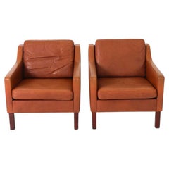 Pair of Scandinavian Mid Century modern Leather Low Lounge chairs