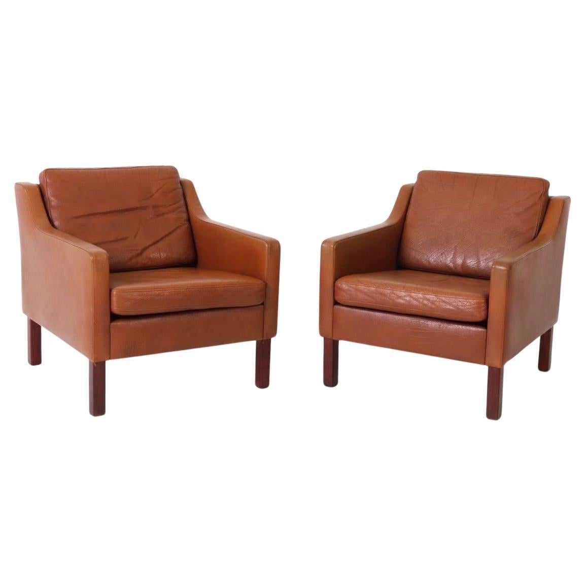 Pair of Scandinavian Mid Century modern Leather Low Lounge chairs