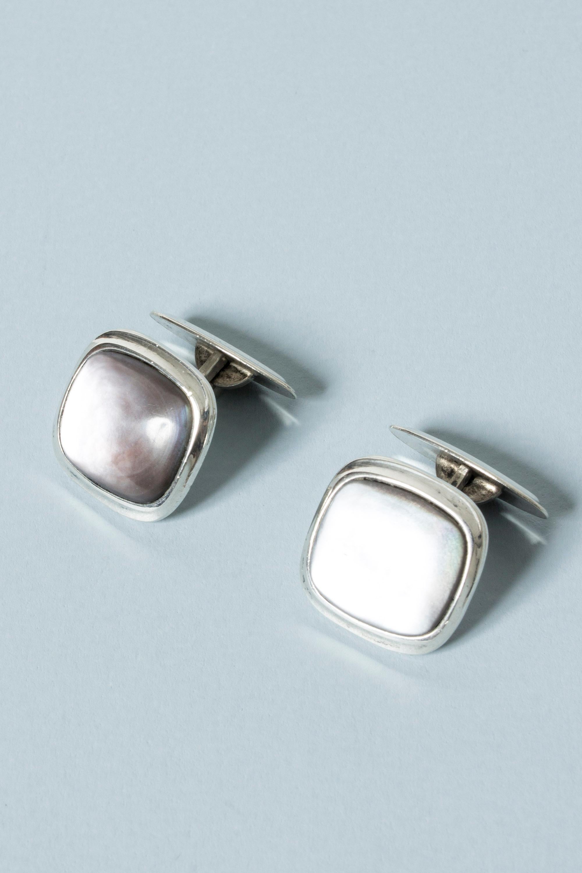 Pair of very elegant Scandinavian midcentury cufflinks with enigmatic moonstones. The stones have a depth and inner glow that make them look almost like pearl.
