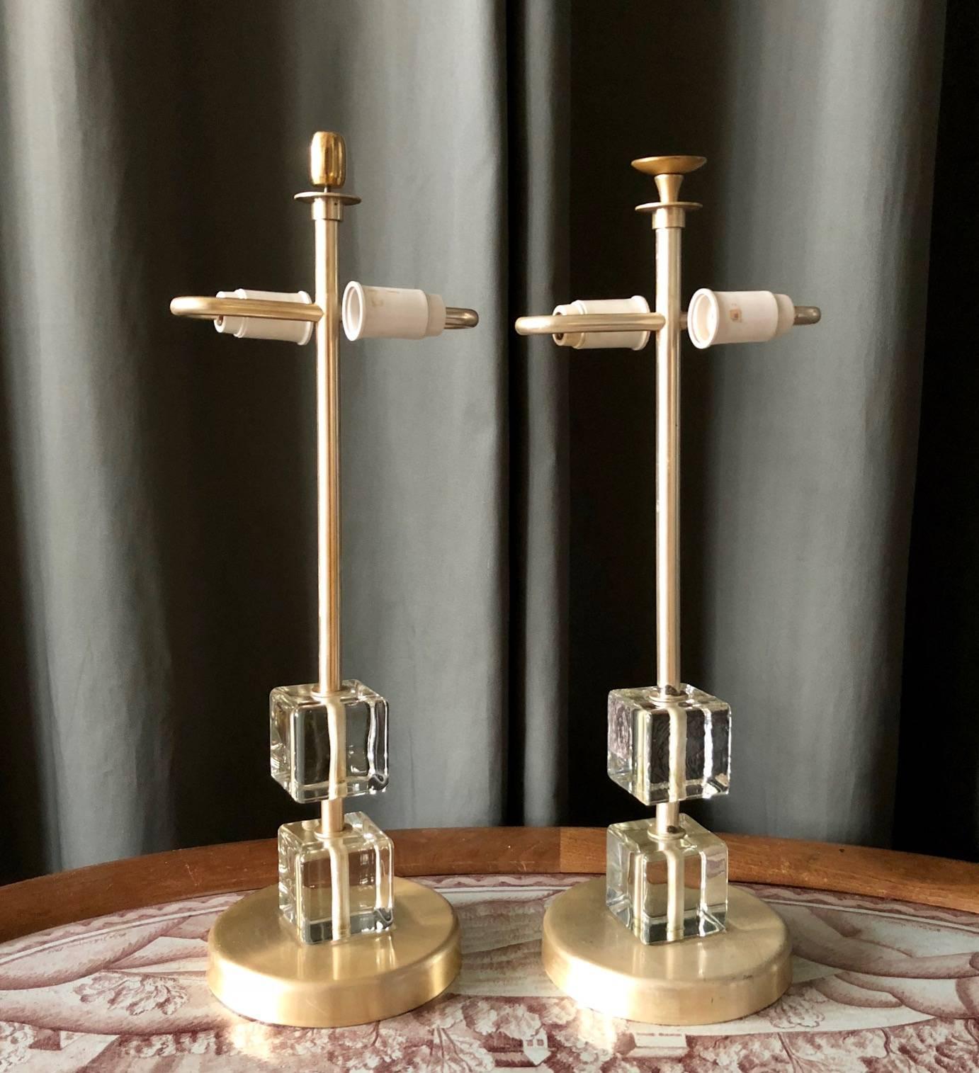 Pair of Scandinavian midcentury table lamps by Malmo Metallvarufabrik, Sweden. Clear glass and metal. Rewiring required. Rewiring available upon request. The shades is not included.