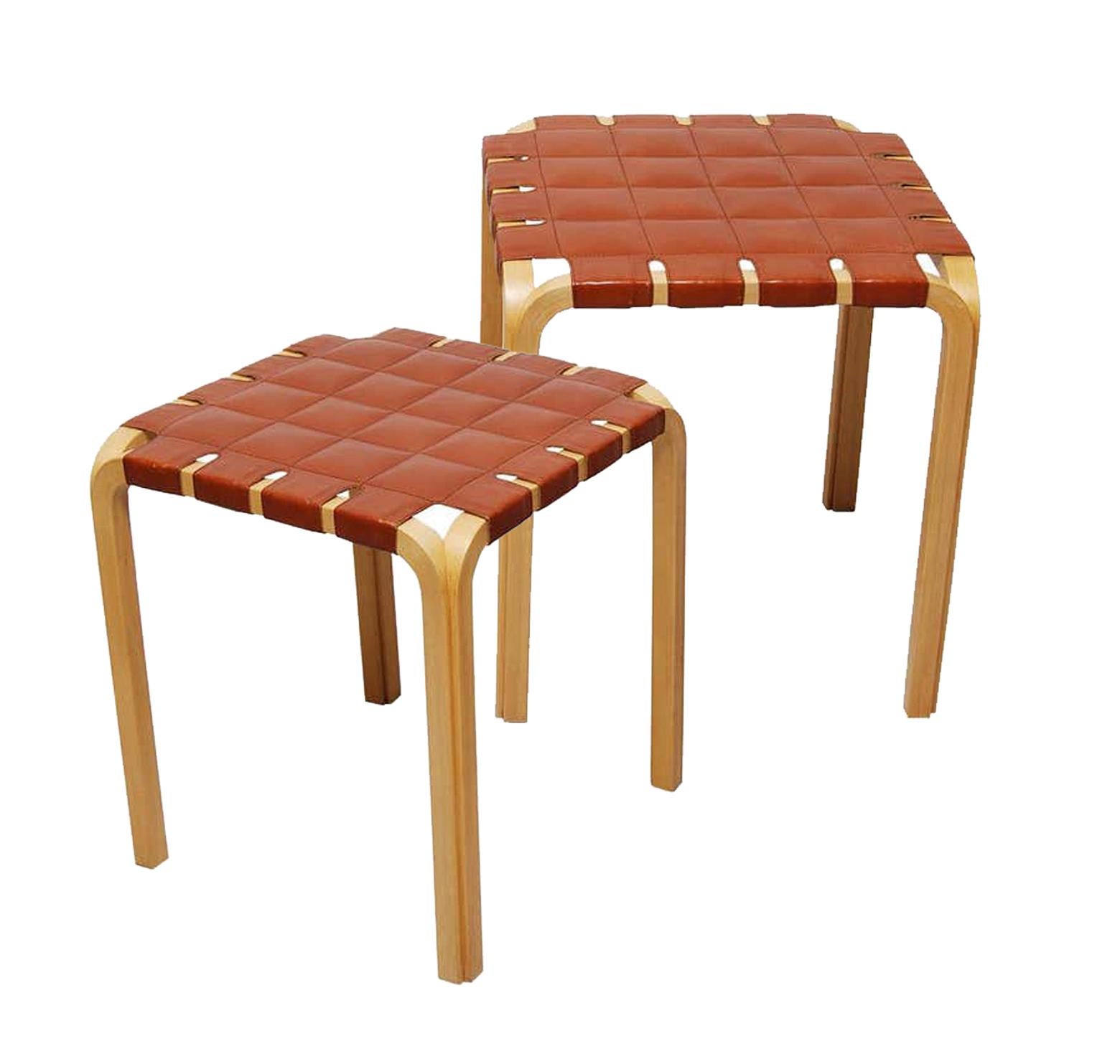 Finnish icons! A pair of Scandinavian Modern Alvar Aalto stool Y61 in birch with original leather seat. Designed in 1947, Alvar Aalto's Y61 stool required a special technique to create the unique birch Y-legs. Original leather seats in great