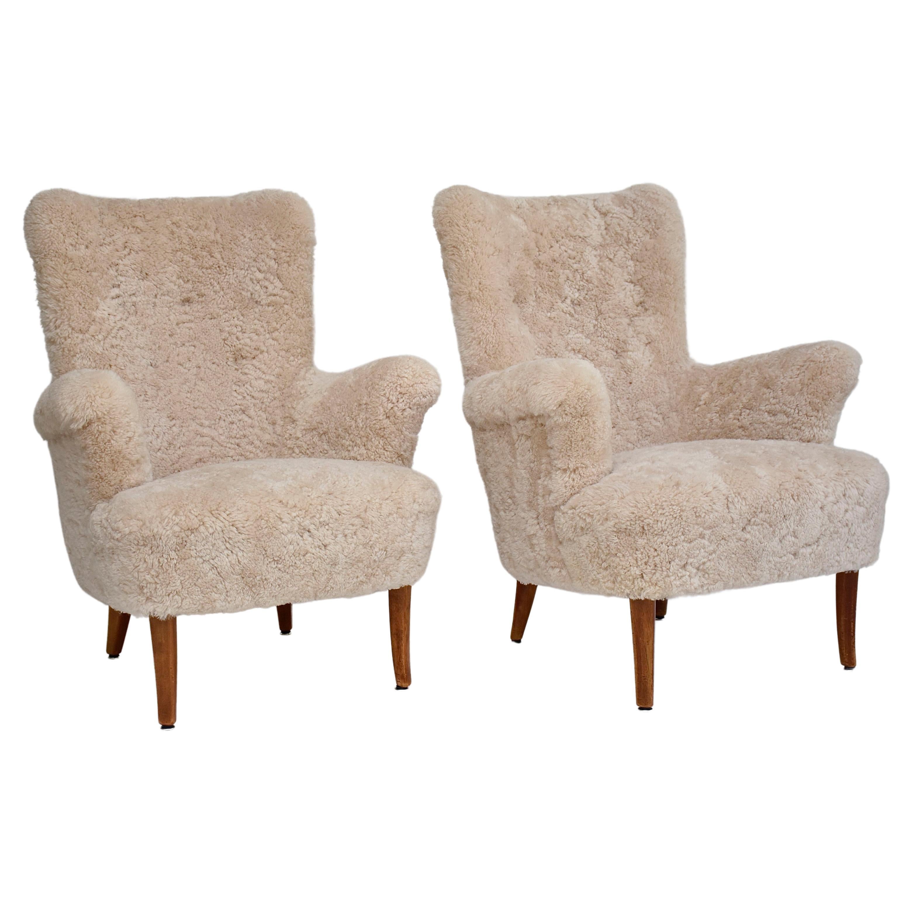 Pair of Scandinavian armchairs 'Stora Furulid' in sheepskin by Carl Malmsten
