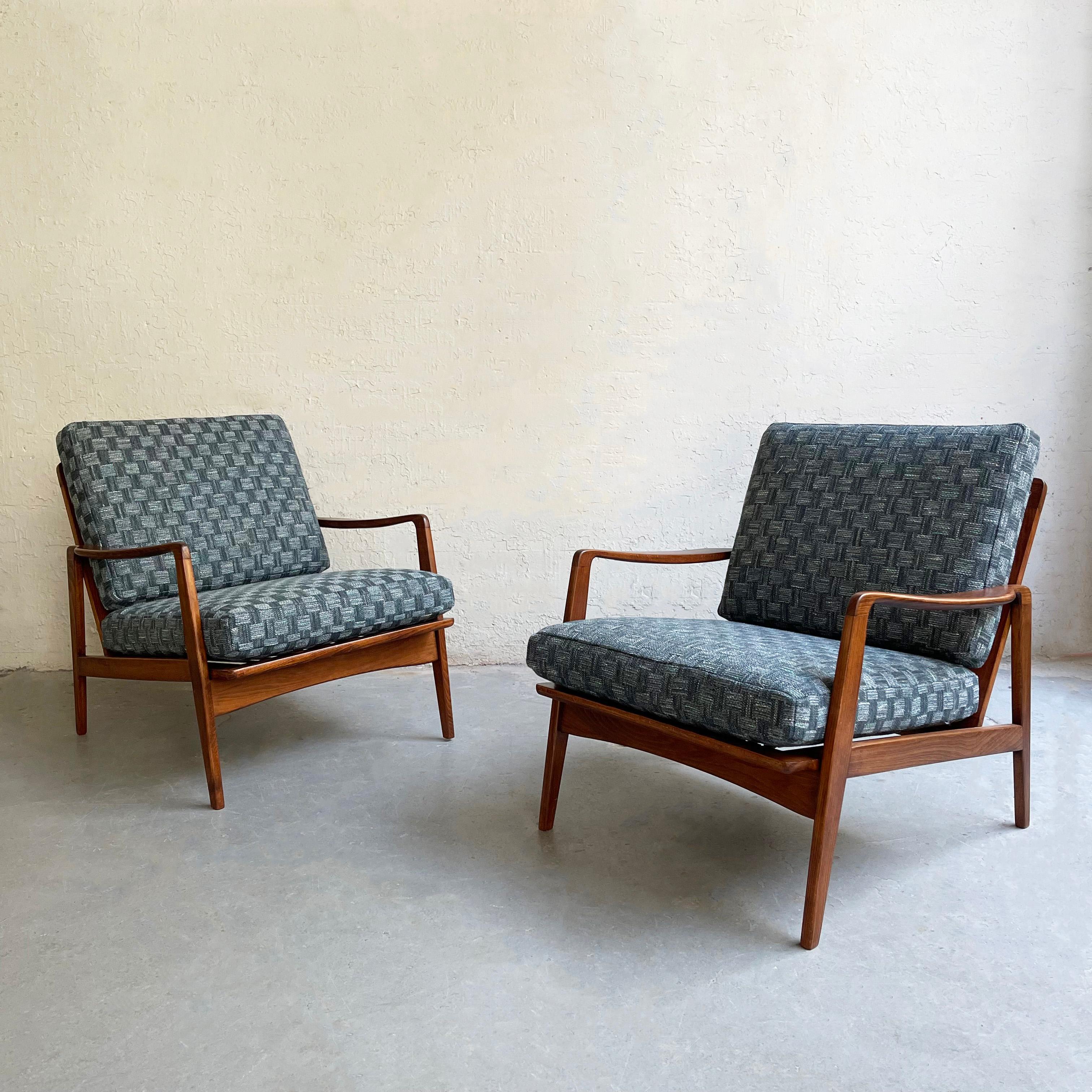Lovely pair of classic, Scandinavian modern lounge chairs feature elegant, beech wood frames with newly upholstered seat and back cushions.