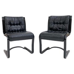 Pair of Scandinavian Modern Black Leather armless chairs by ASKO