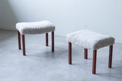 Pair of Scandinavian Modern footstools with sheepskin, 1940s