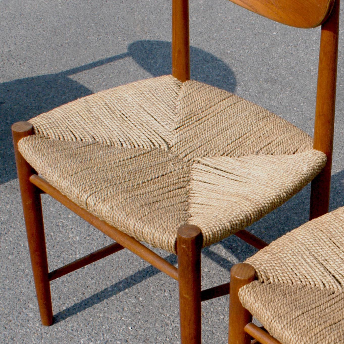Iconic excellent Scandinavian modern teak chairs with original cane seats, manufactured by Soborg Mobler.
   