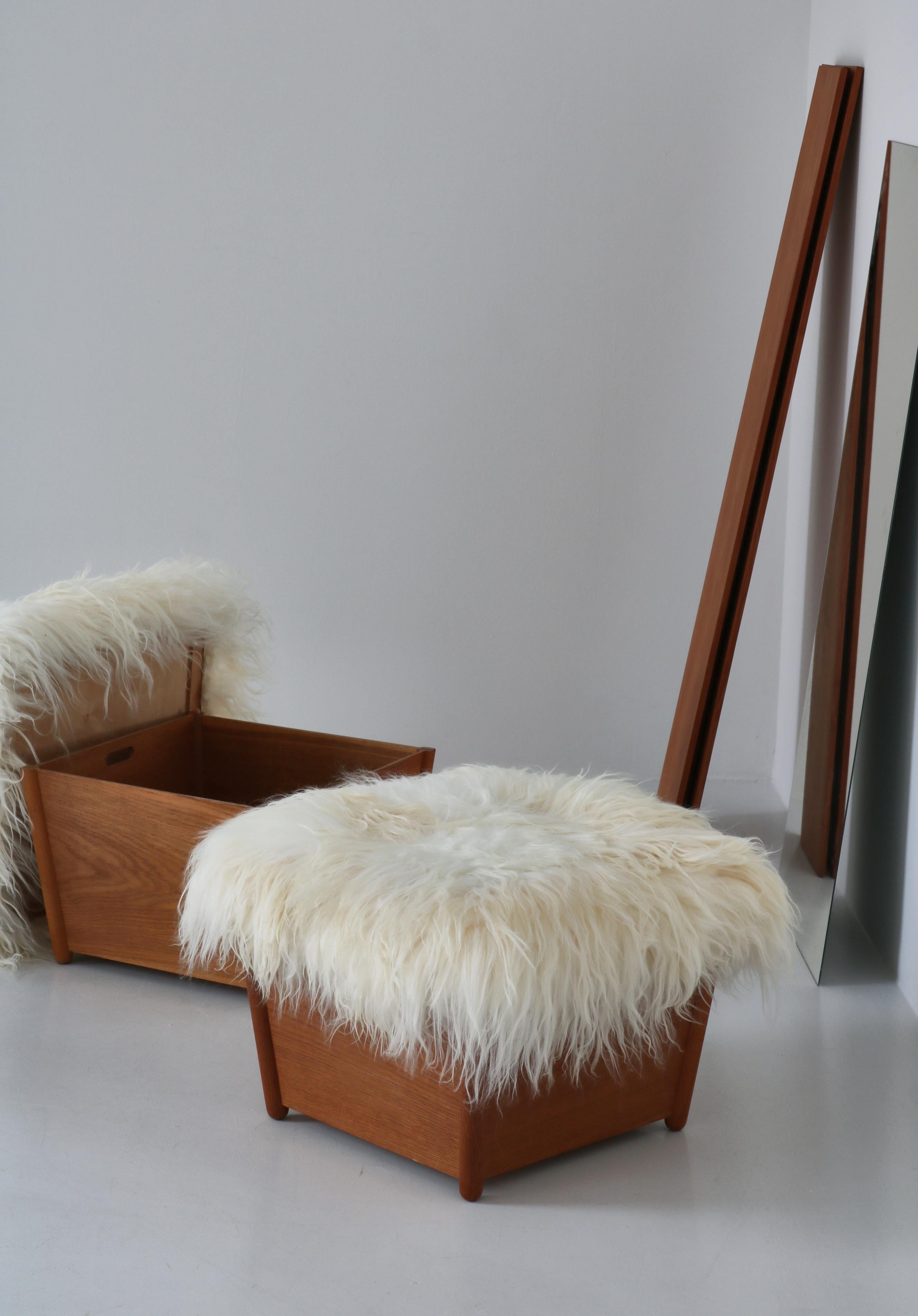 Set of charming stools by Danish Designer Arne Wahl-Iversen made in the 1960s. The stools have been reupholstered in long-haired organic sheepskin. The stools are made for storage.

Provenance: Bought directly from the estate of Wahl-Iversen.