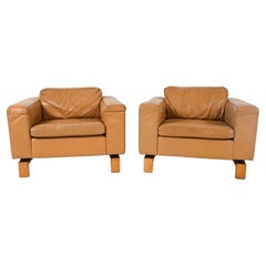 Pair of Scandinavian modern Tan Leather Lounge Club chairs with wood base
