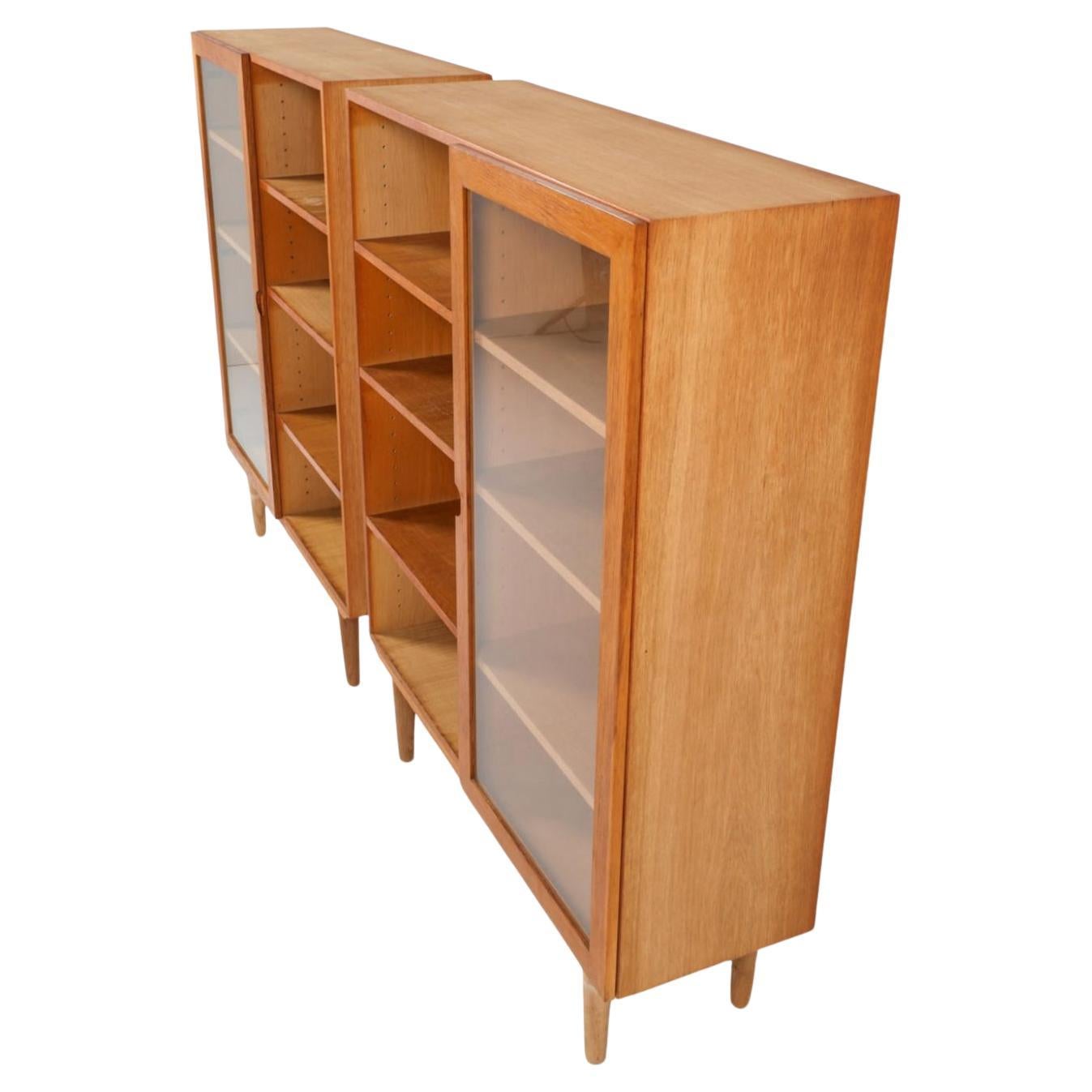 Scandinavian Modern Pair of Scandinavian modern white oak bookcases with single glass doors