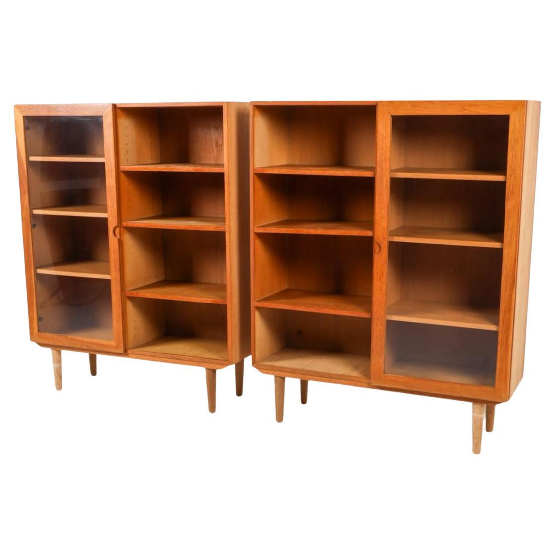 Pair of Scandinavian modern white oak bookcases with single glass doors In Good Condition In BROOKLYN, NY