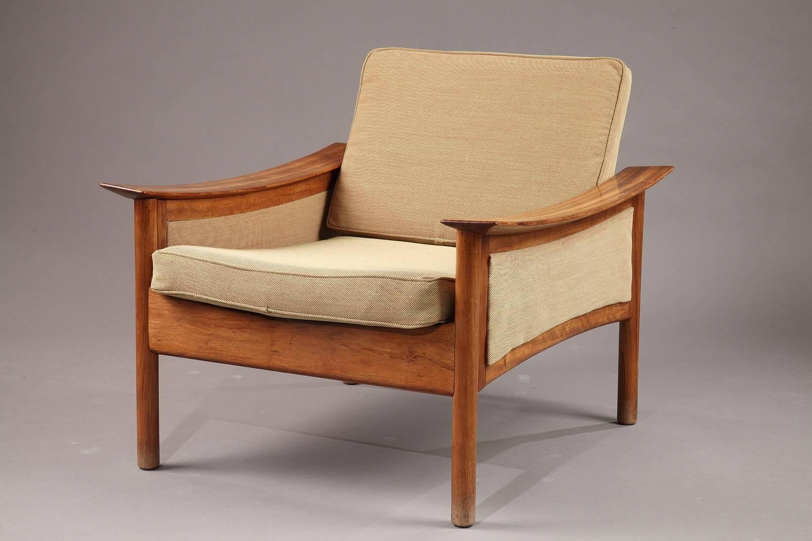 Pair of Scandinavian armchairs in teak with beige upholstery by the Norwegian designer Oskar Langlo, edited by P. I. Langlos Fabrikker A/S, in Stranda, Norway. Made in the 1950s, these organically shaped armchairs are a typical item of the so-called