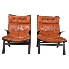 Pair of Scandinavian Tufted Leather and Curved wood lounge chairs