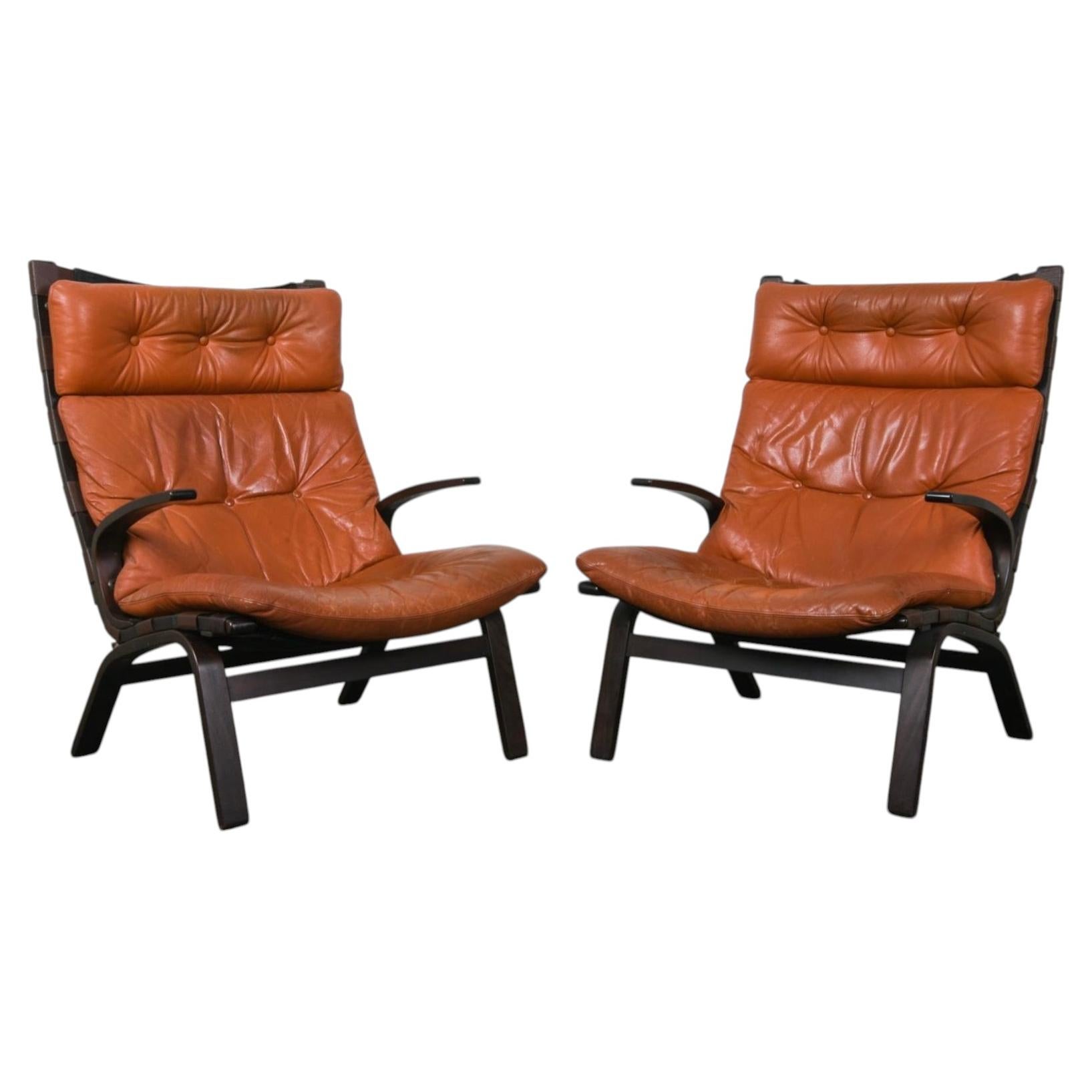Pair of Scandinavian Tufted Leather and Curved wood lounge chairs