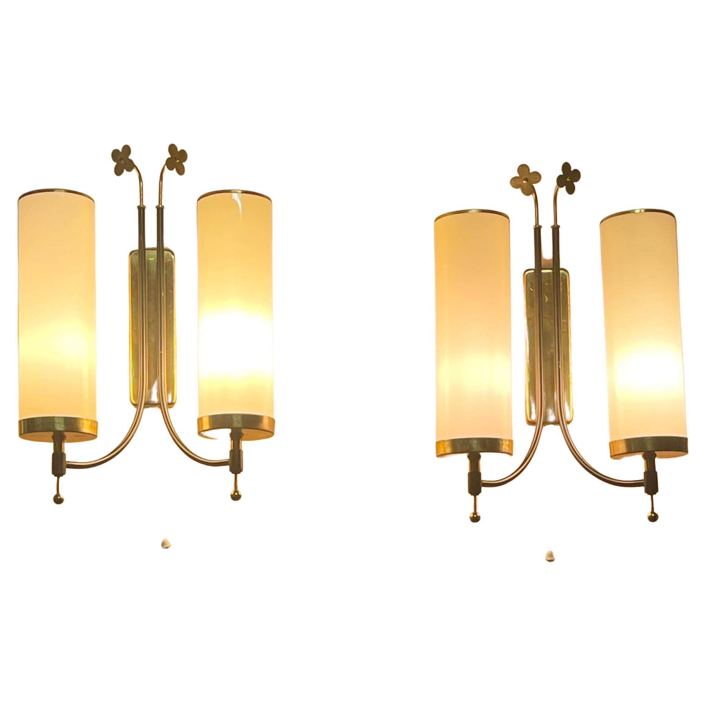 A beautiful pair of modernist Scandinavian wall sconces with opal glass tubes, brass and black lacquered iron in the style of Paavo Tynell, circa 940s.
Socket: each two x e14 for standard screw bulbs.
New wiring for US standards on request.