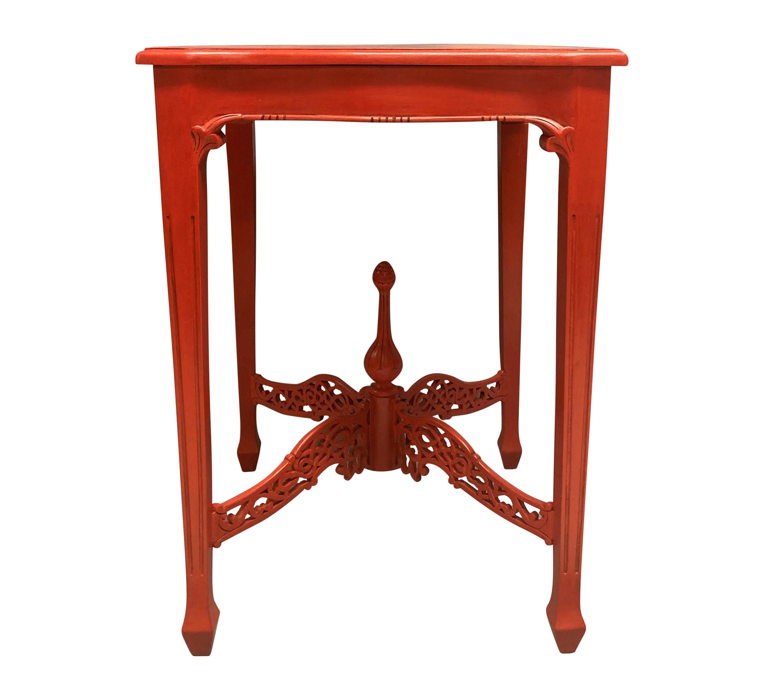 A pair of scarlet English Chippendale style side tables, with fretwork stretchers and finial.