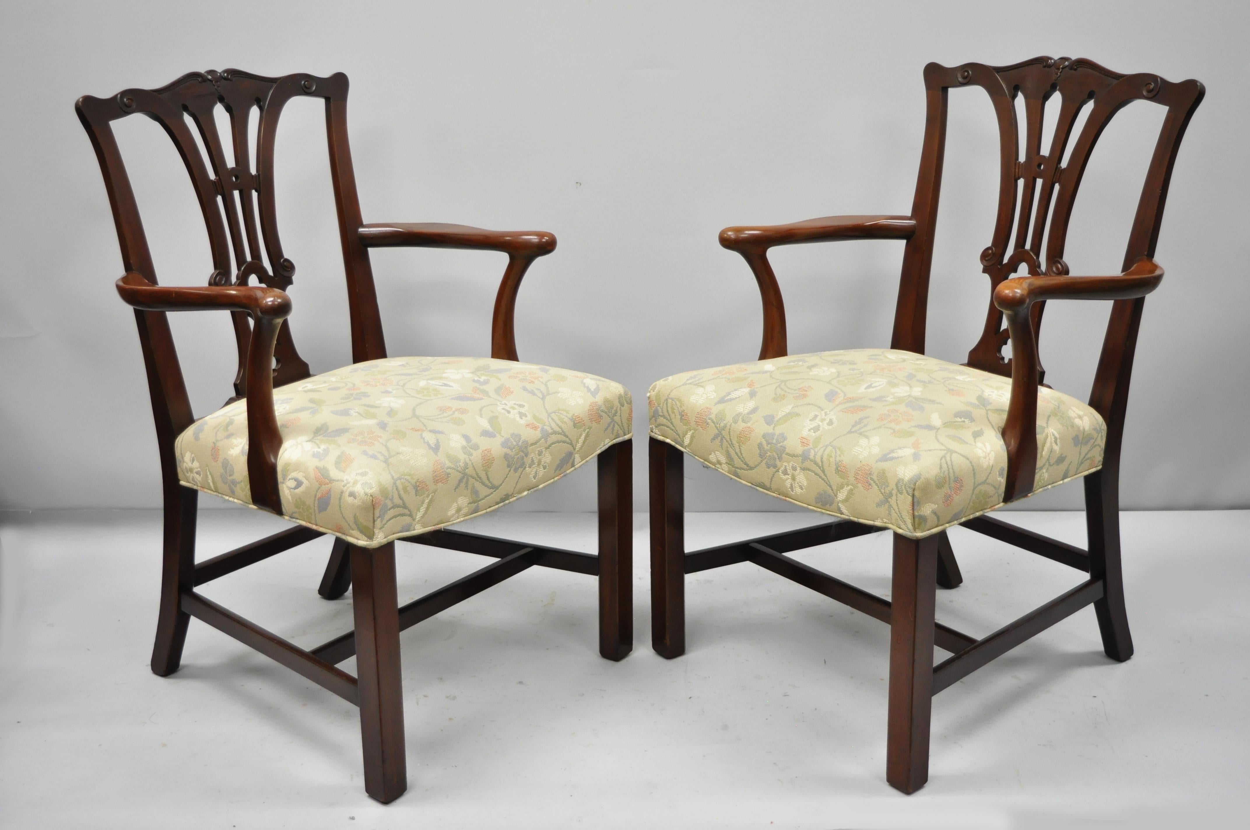 Pair of Schmieg & Kotzian mahogany Chippendale style dining chairs armchairs. Item features solid mahogany wood construction, original stump to underside, serial number, quality American craftsmanship, circa 1940. Measurements: 38