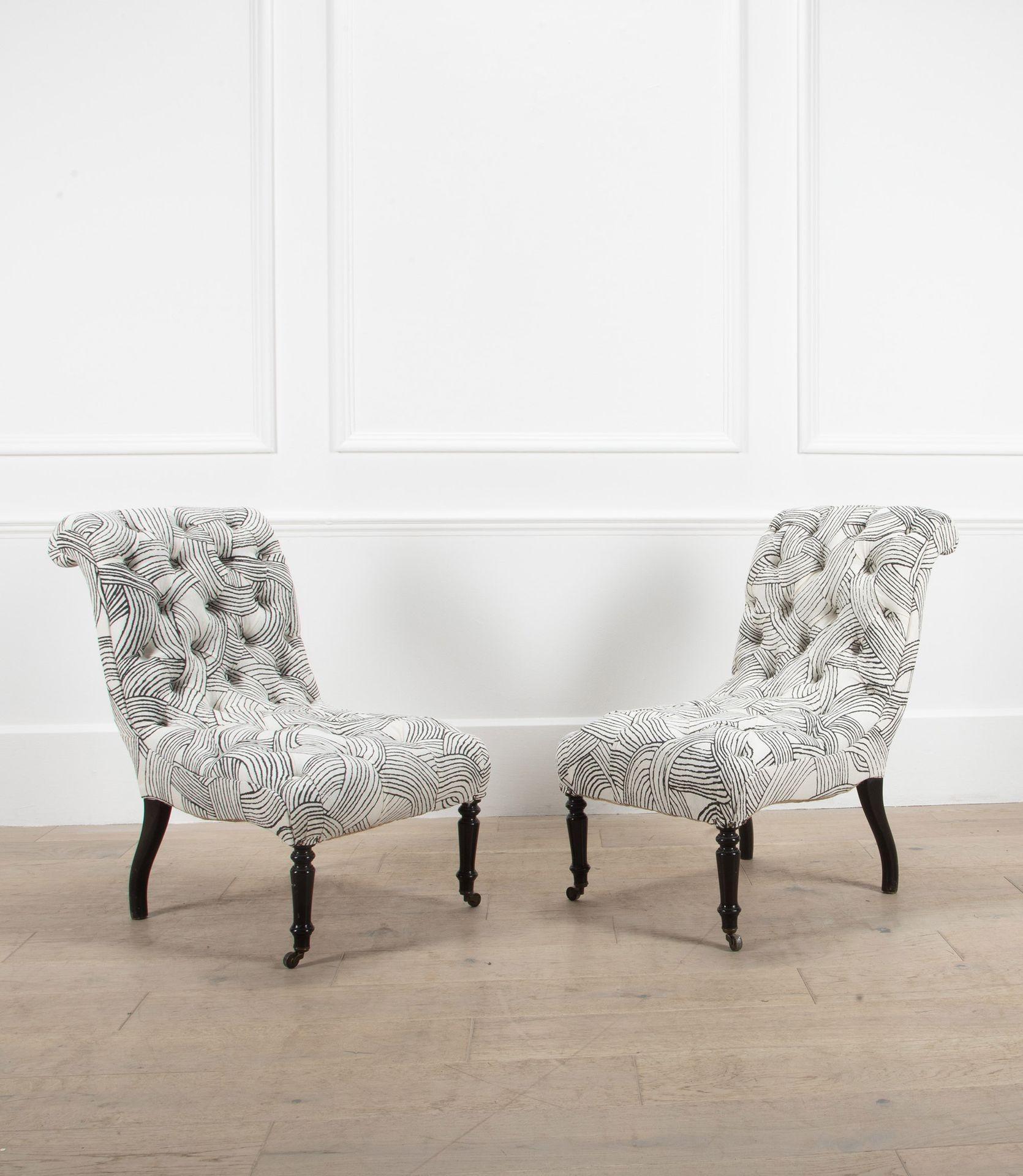 A pair of French Napoleon III Button back side chairs. 
 
With their elegant ebonised legs, recently reupholstered in Schumacher Freeform linen.