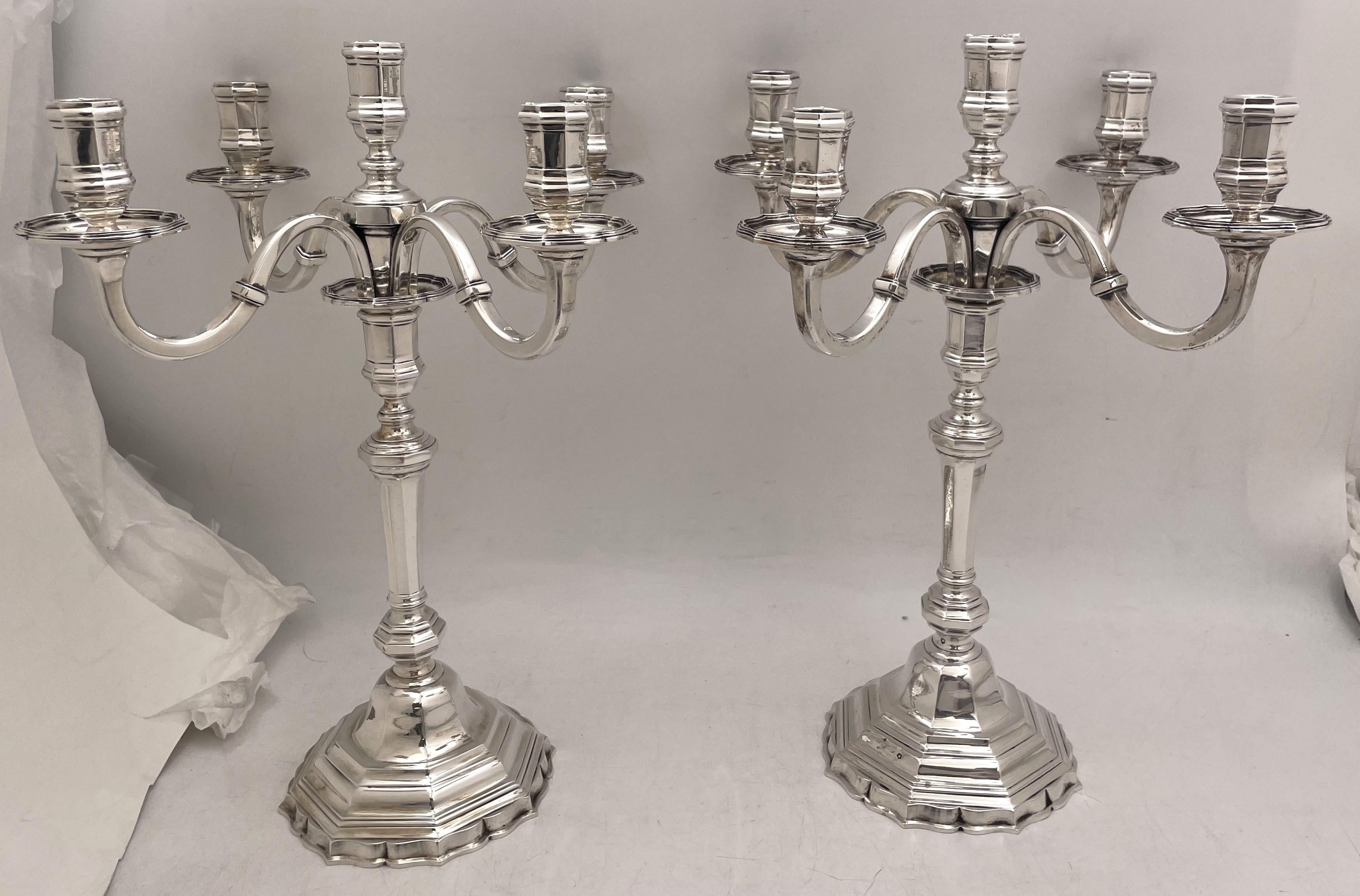 Pair of Schwarz & Steiner, Austrian 0.800 silver 5-light candelabra from early 20th century in Art Deco style, with an elegant, geometric design. They measure 15'' in height by 11 3/4'' from arm to arm, weigh 109 troy ounces, and bear hallmarks as