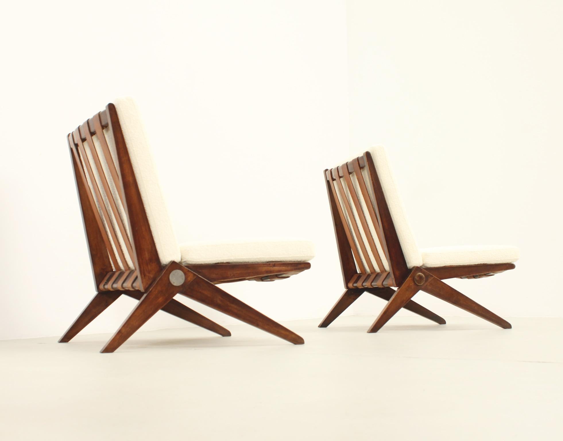 Pair of Scissors chairs designed by Pierre Jeanneret in 1948 and produced by Knoll International from 1948 to 1966. Early edition in stained maple wood with leather straps and new cushions upholstered with Bisson Bruneel fabric.