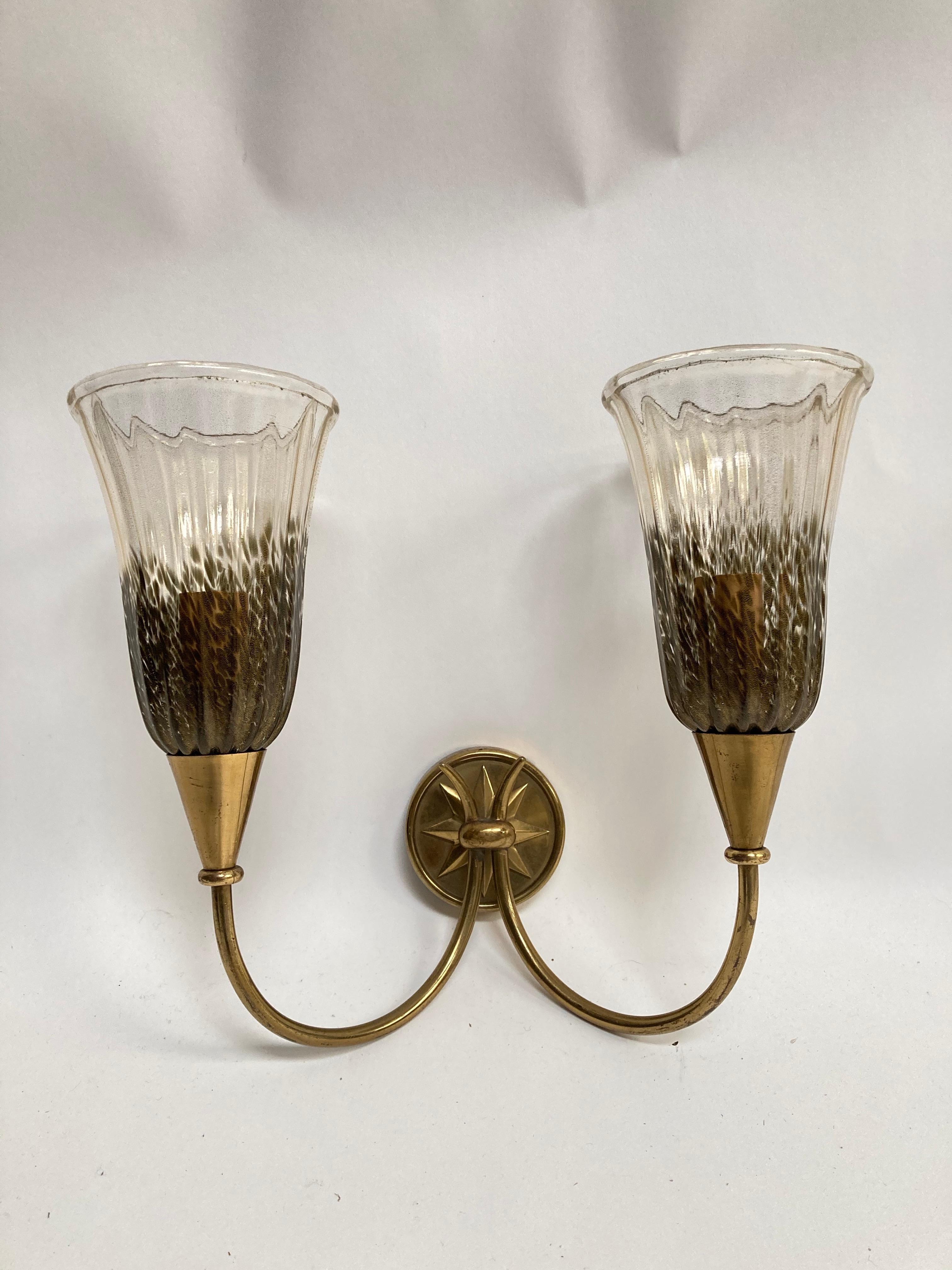 Very elegant pair of sconces made in brass and Murano glass
Designed late 40's or 50's.
  