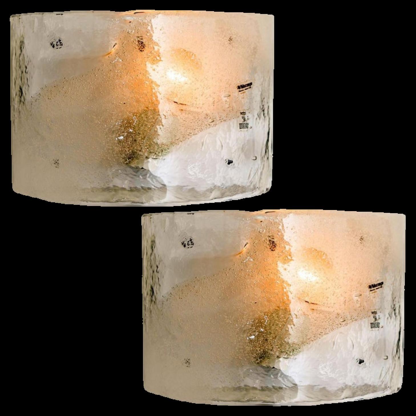 Pair of sconces by Carlo Nason for Mazzega, circa 1970.
Transparent and opal tinted glass.

Perfect condition. Ready to use.
Dimensions
Width ca. 35 cm height : ca 18 cm Depth : 14 cm

Timeless creations, remarkable for their originality and their
