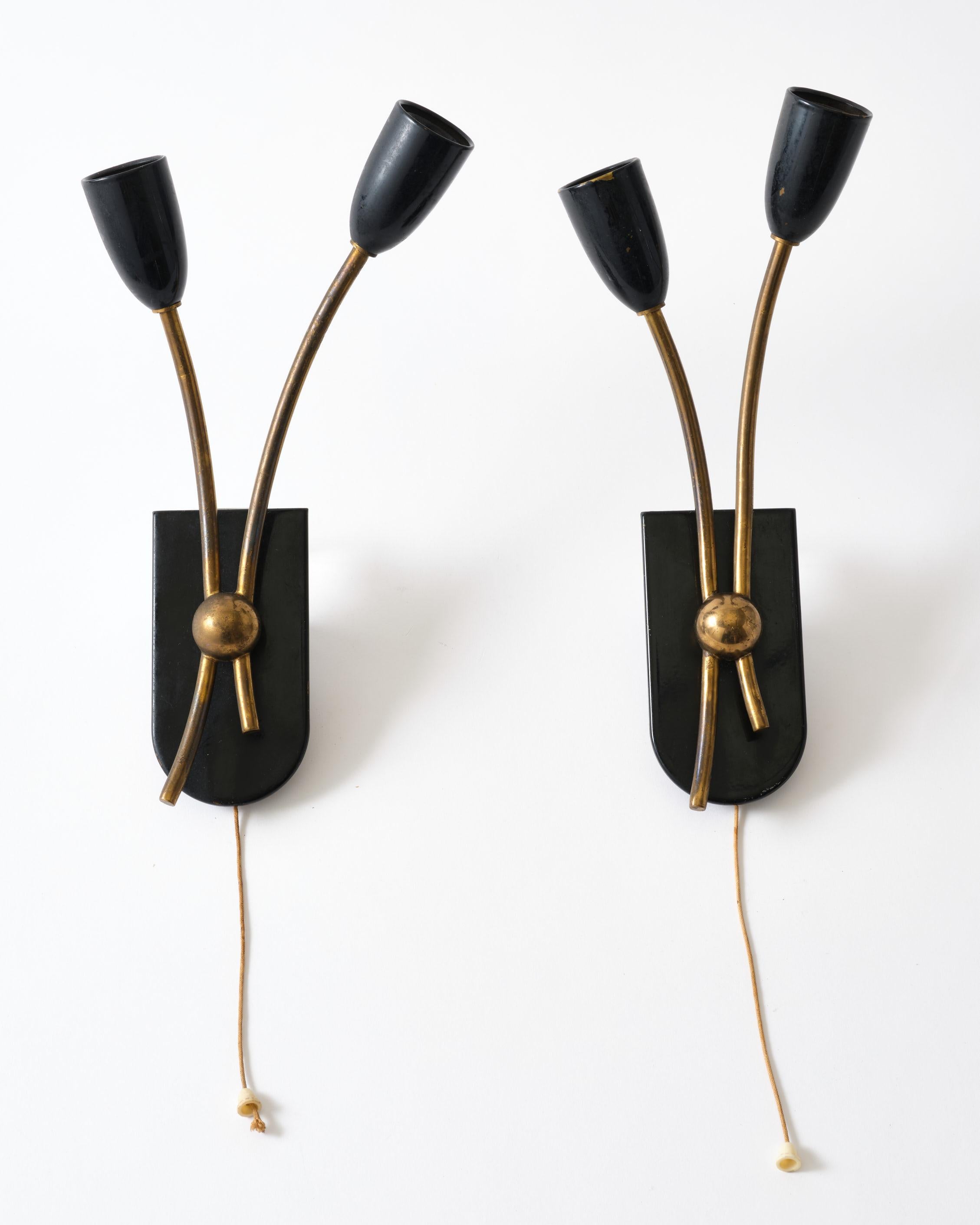 Mid-century brass and metal pair of sconces from Italy, C 1950. Very charming set.
Original condition. The brass can be polished.
Each lamp is 11.75