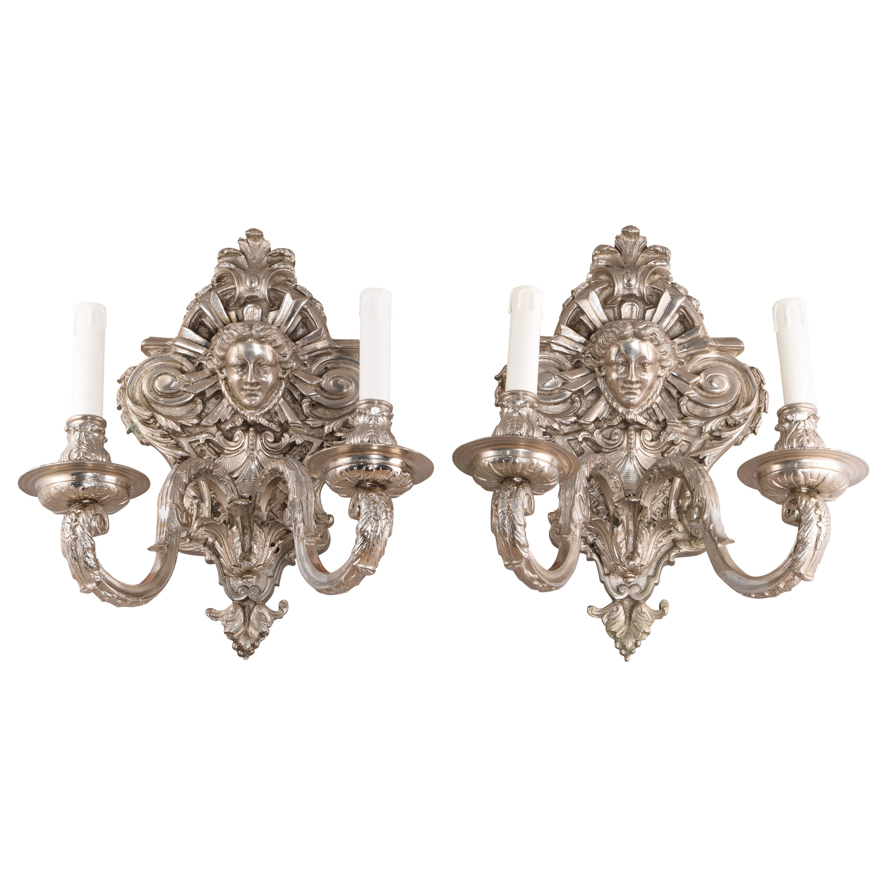 Coppia di appliques. Bronzo. Finitura argento.