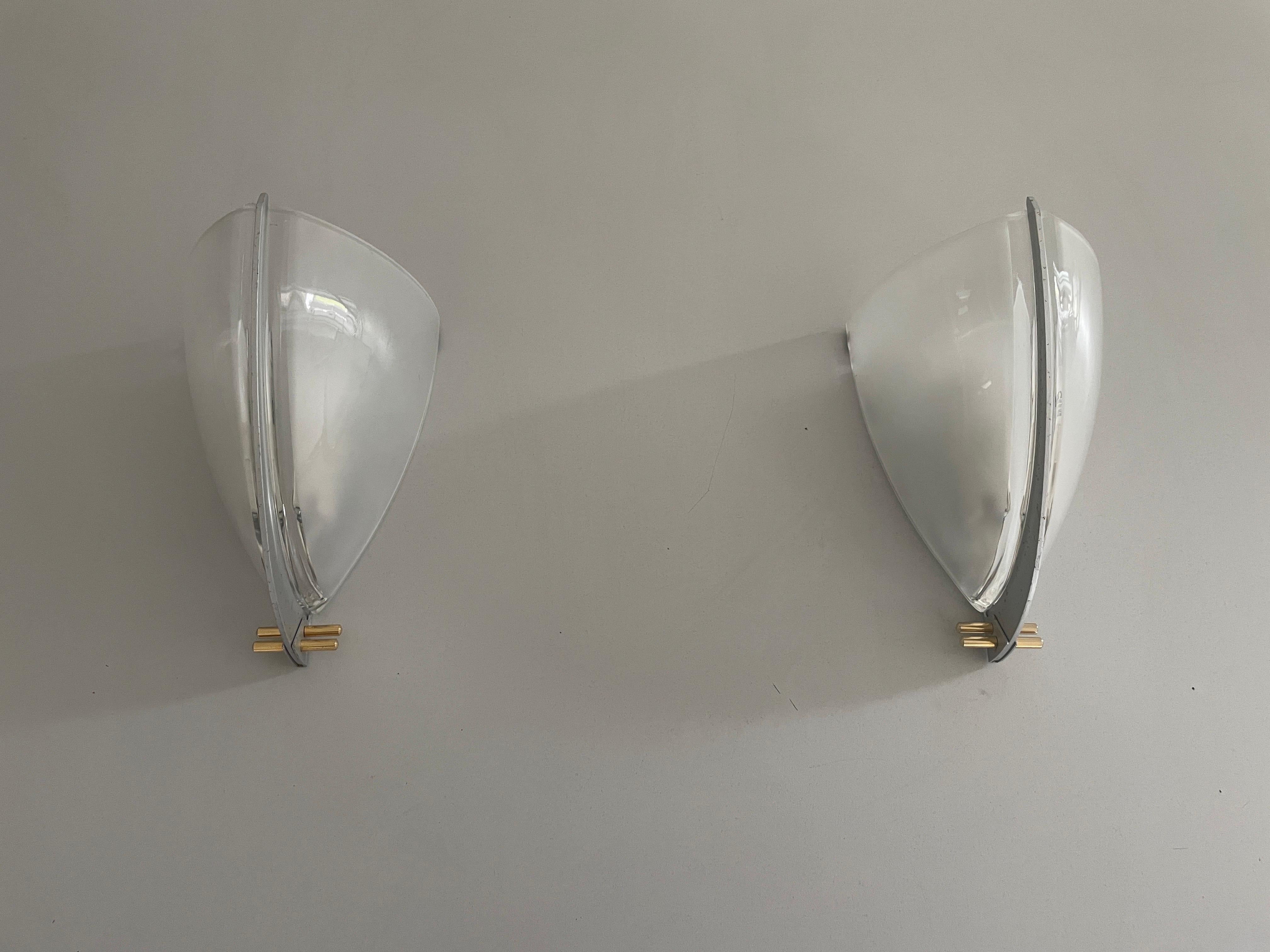 Pair of Sconces by Ernesto Gismondi for Artemide, 1980s, Italy

Very elegant and Minimalist wall lamps.

Lamps are in very good condition.

These lamps works with E27 standard light bulbs. 
Wired and suitable to use in all countries. (110-220