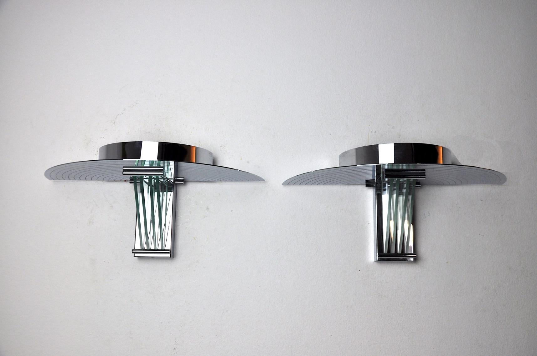 Pair of wall lights by designer garcia garay in the memphis style, designed and produced in spain in the 1970s. Cut glass and chromed metal structure. Unique object that will illuminate and bring a real design touch to your interior. Electricity