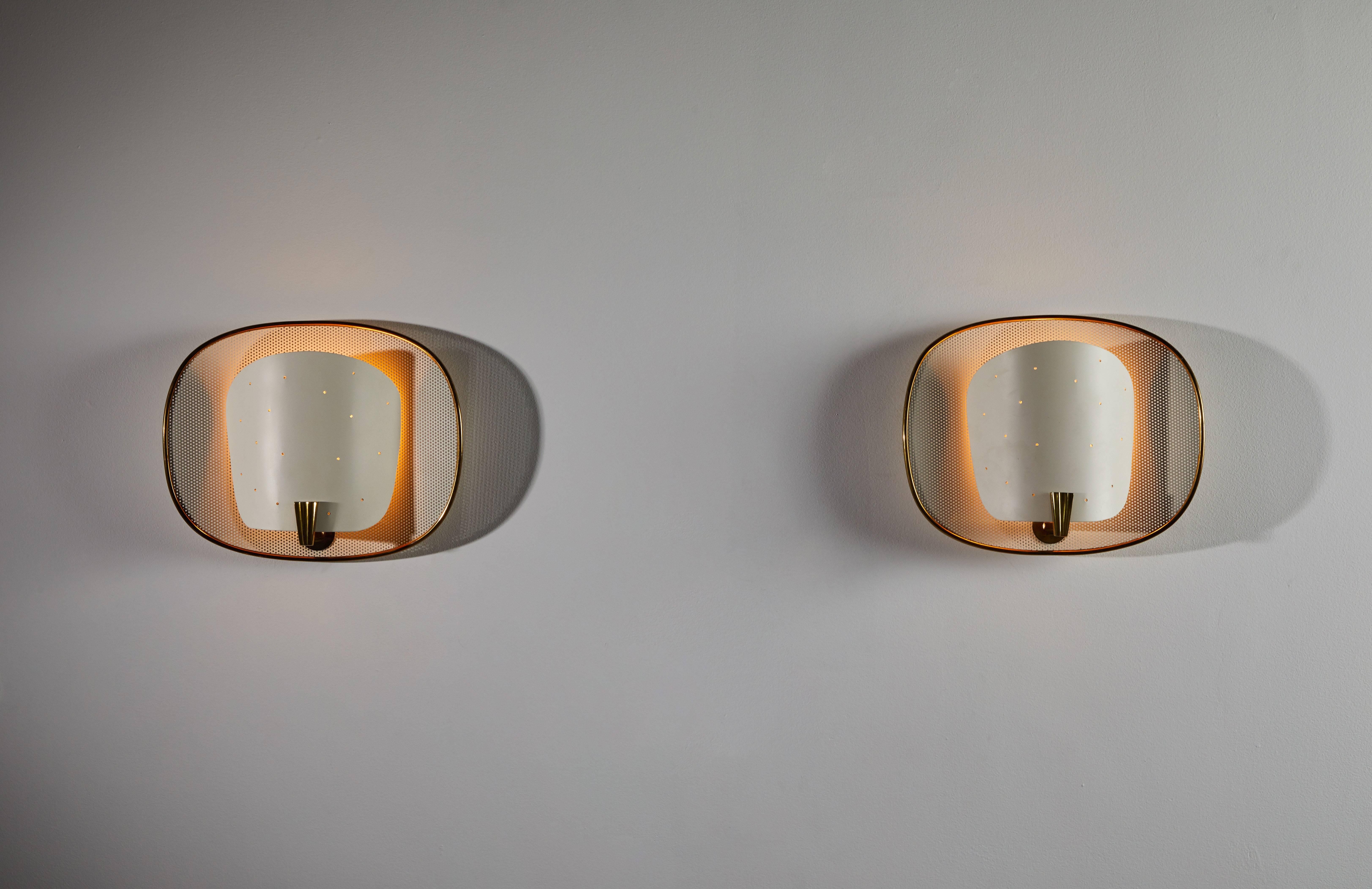 Pair of sconces by Lunel. Designed and manufactured in France, circa 1950s. Fully restored and powder coated shades with brass hardware. Wired for US junction boxes. Each light takes one E27 75w maximum bulb.