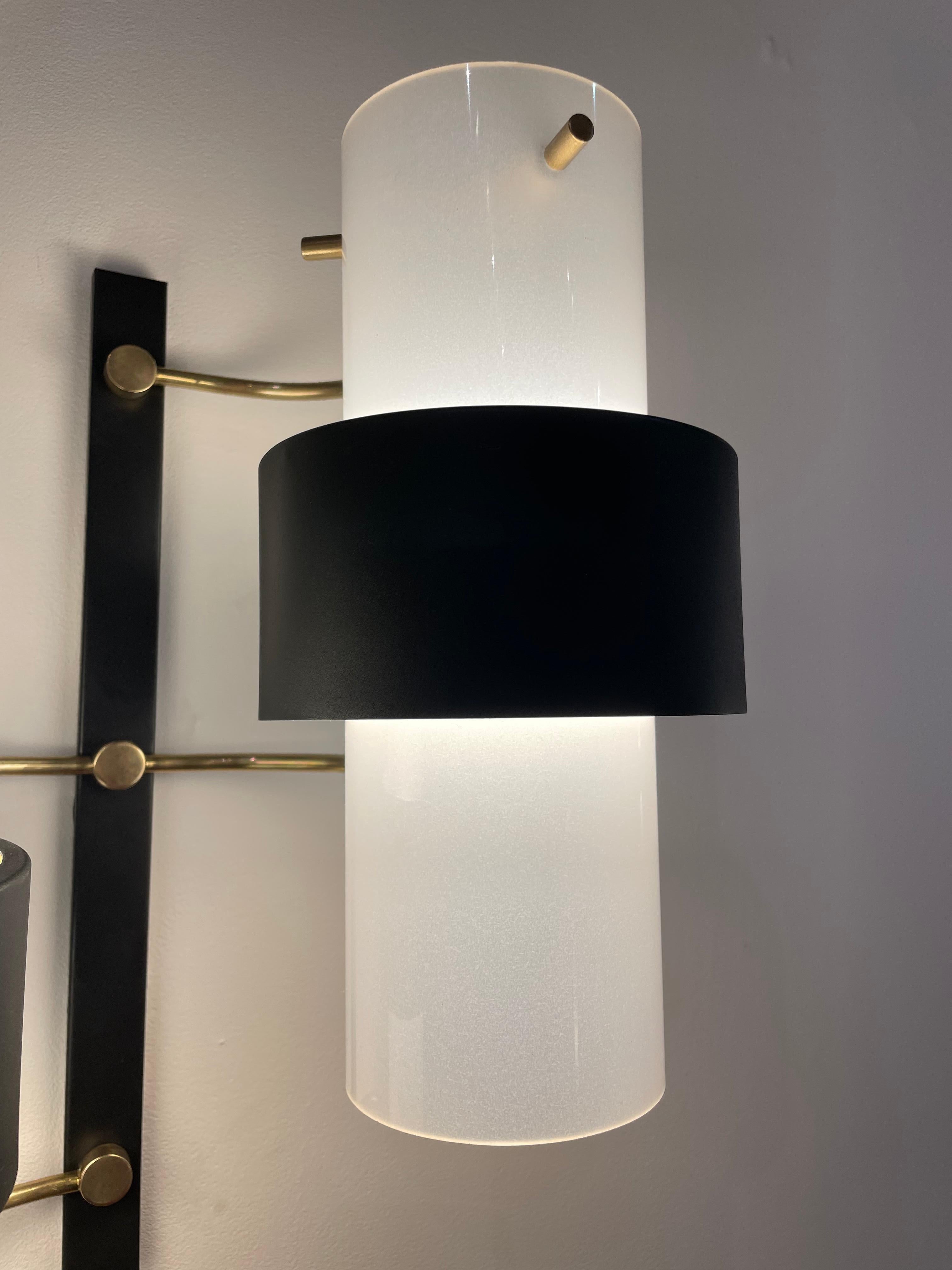 20th Century Pair of sconces by Maison Lunel For Sale