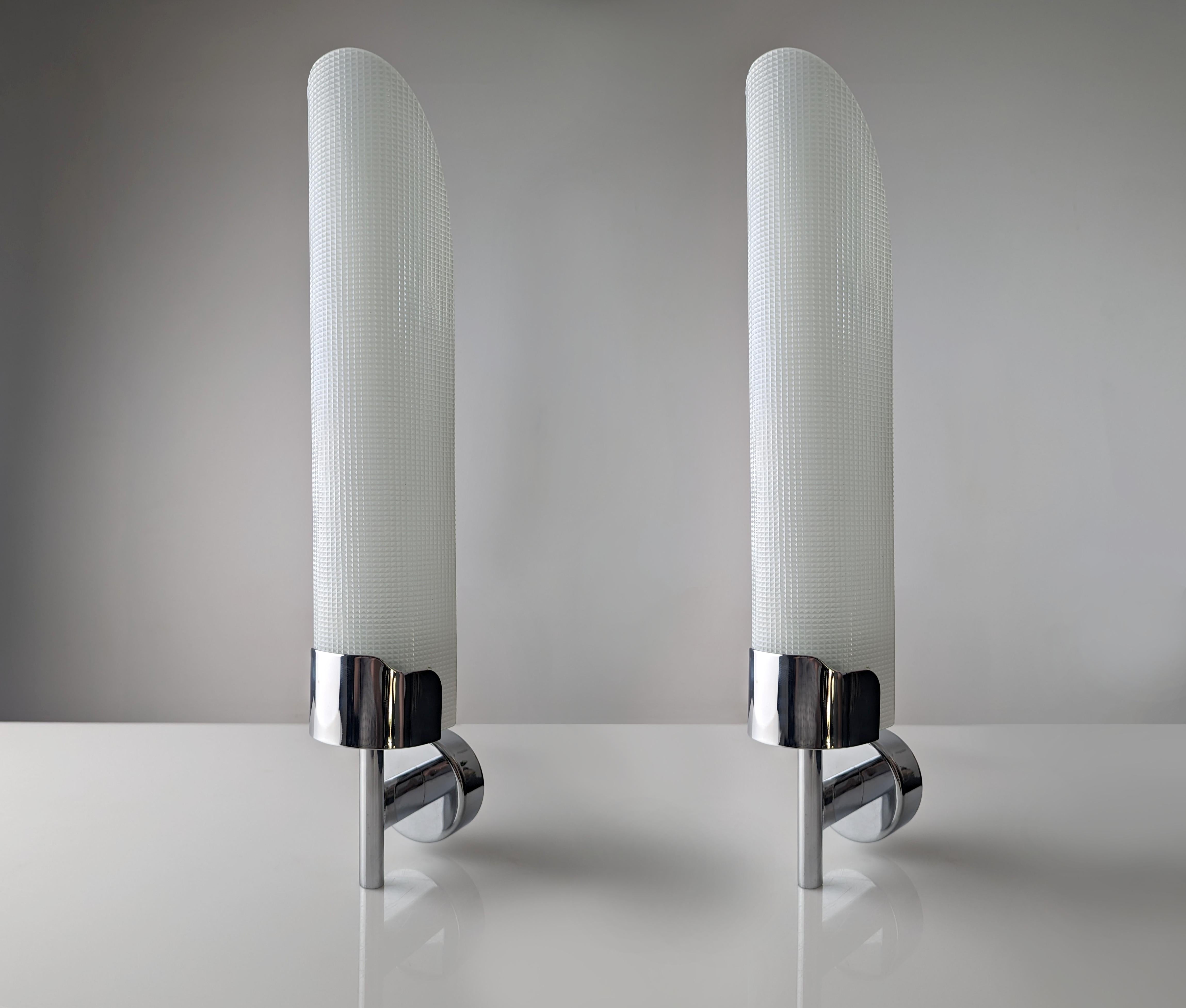These exclusive Fontana Arte Model 2080 sconces were designed by Max Ingrand and made in Italy in 1955. It is an exclusive reissue from the 80s where they raised the height to an incredible 50 cm compared to the 40 cm of the original designs.

With