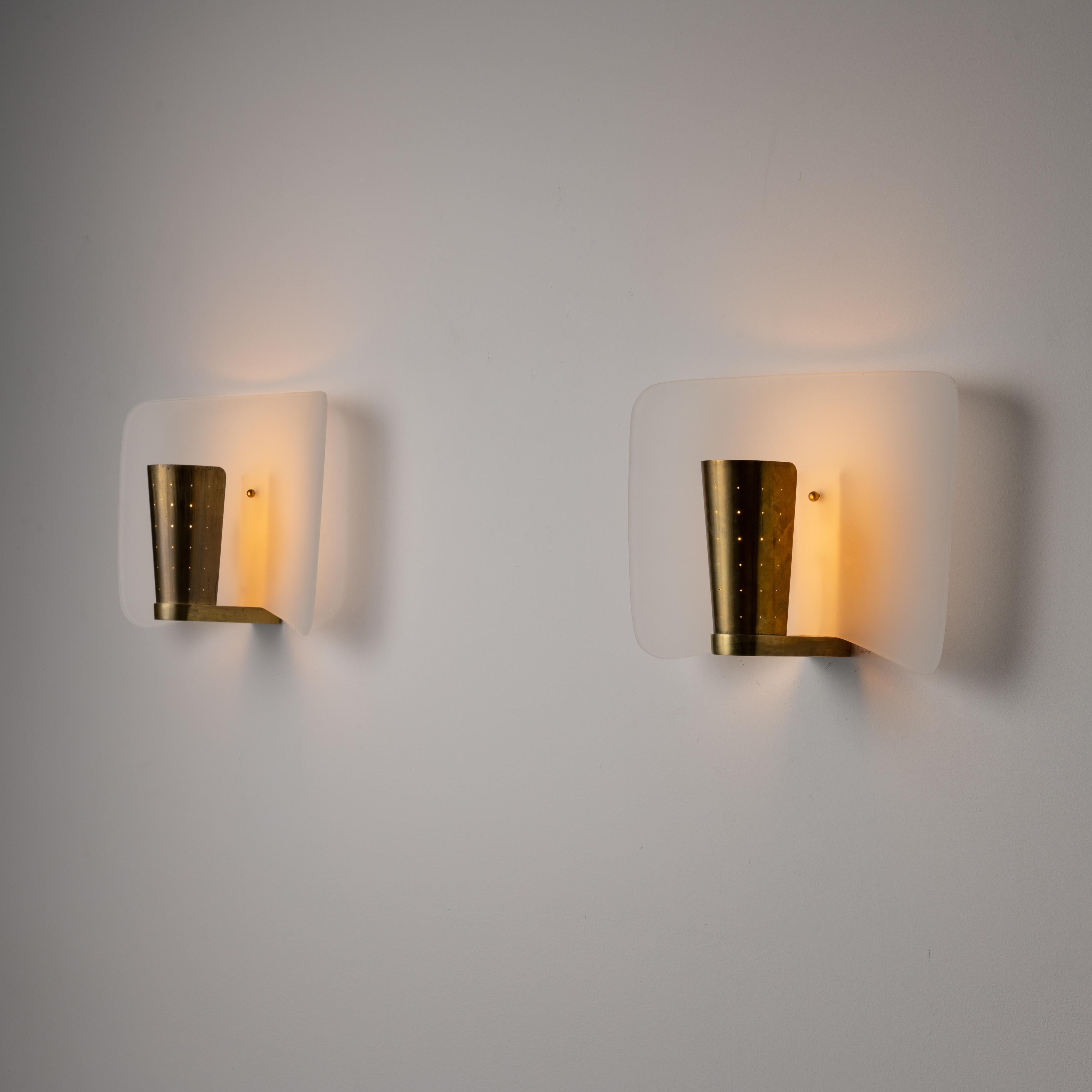 Patinated Rare Pair of Sconces by Pierre Disderot