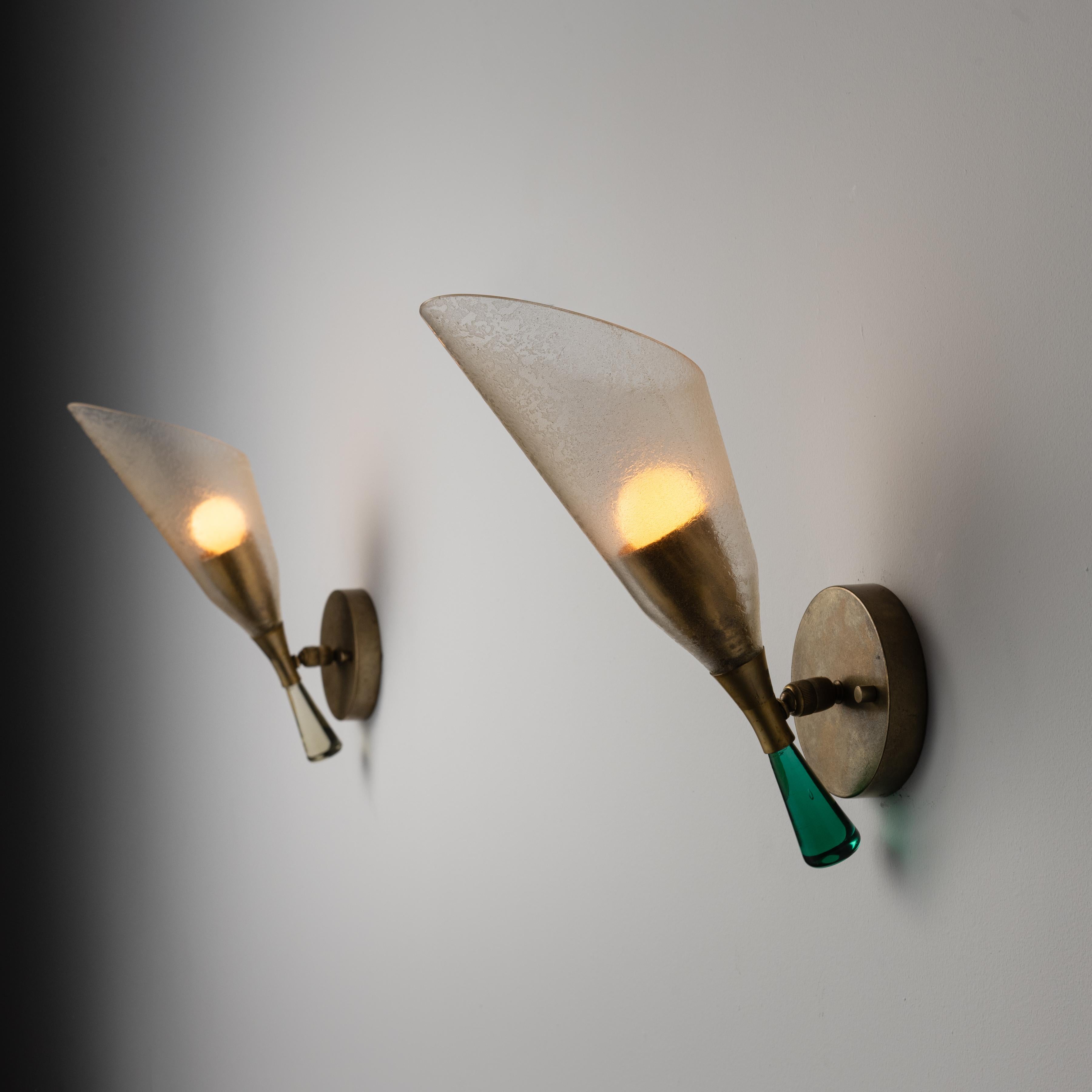 Pair of Sconces by Seguso Vetri d'Arte. Designed and manufactured in Italy, circa the 1960s. Two of the same model, but different finishes to the bottom glass stem finial. Each sconce comprises of a beautiful one-of-a-kind etched glass tulip glass,