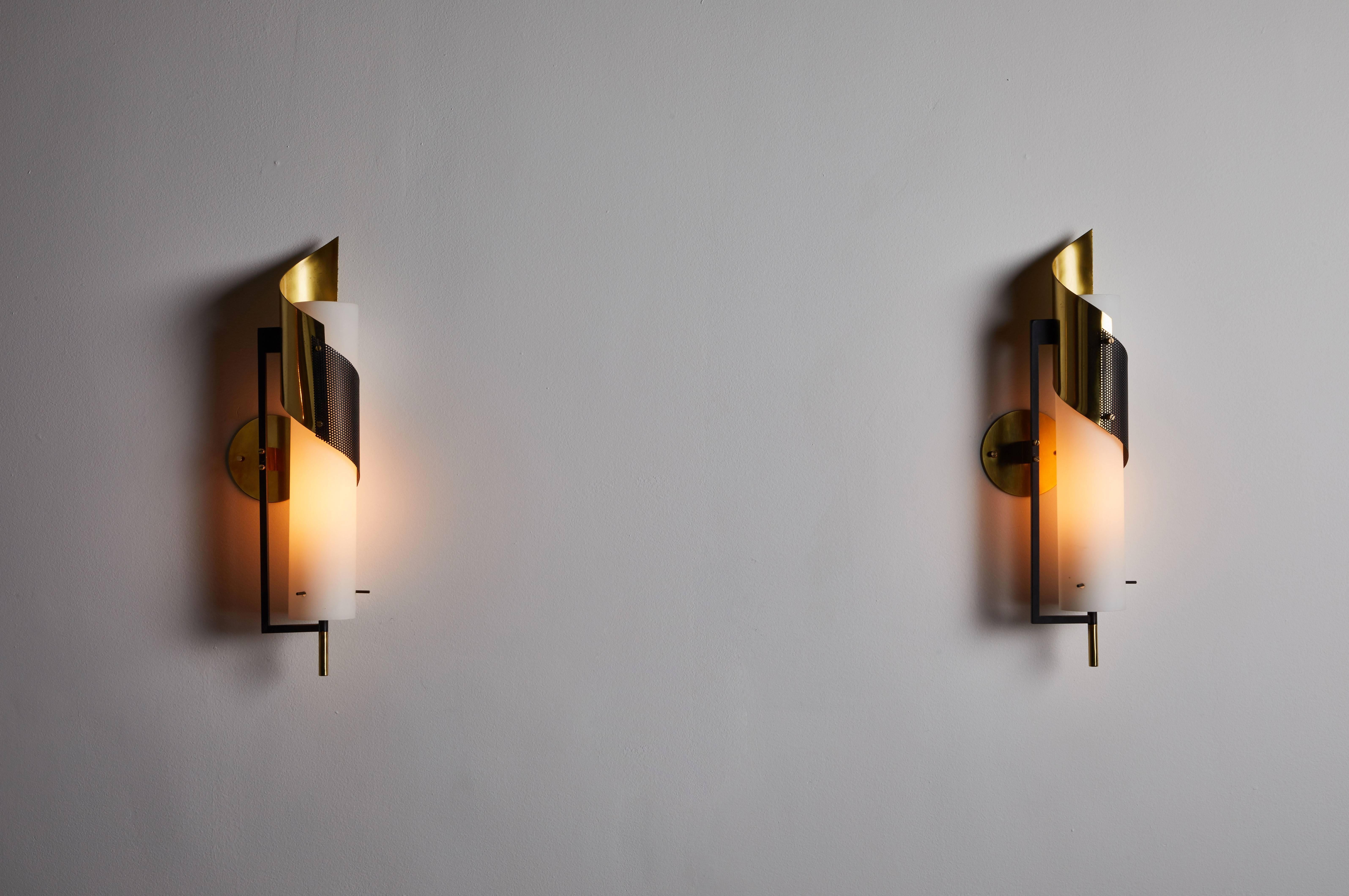 Pair of sconces by Stilnovo. Manufactured in Italy, circa 1960s. Brushed satin glass, enameled metal and brass. Rewire for US junction boxes. Custom brass backplates. Each sconces takes one E27 100w maximum bulb.