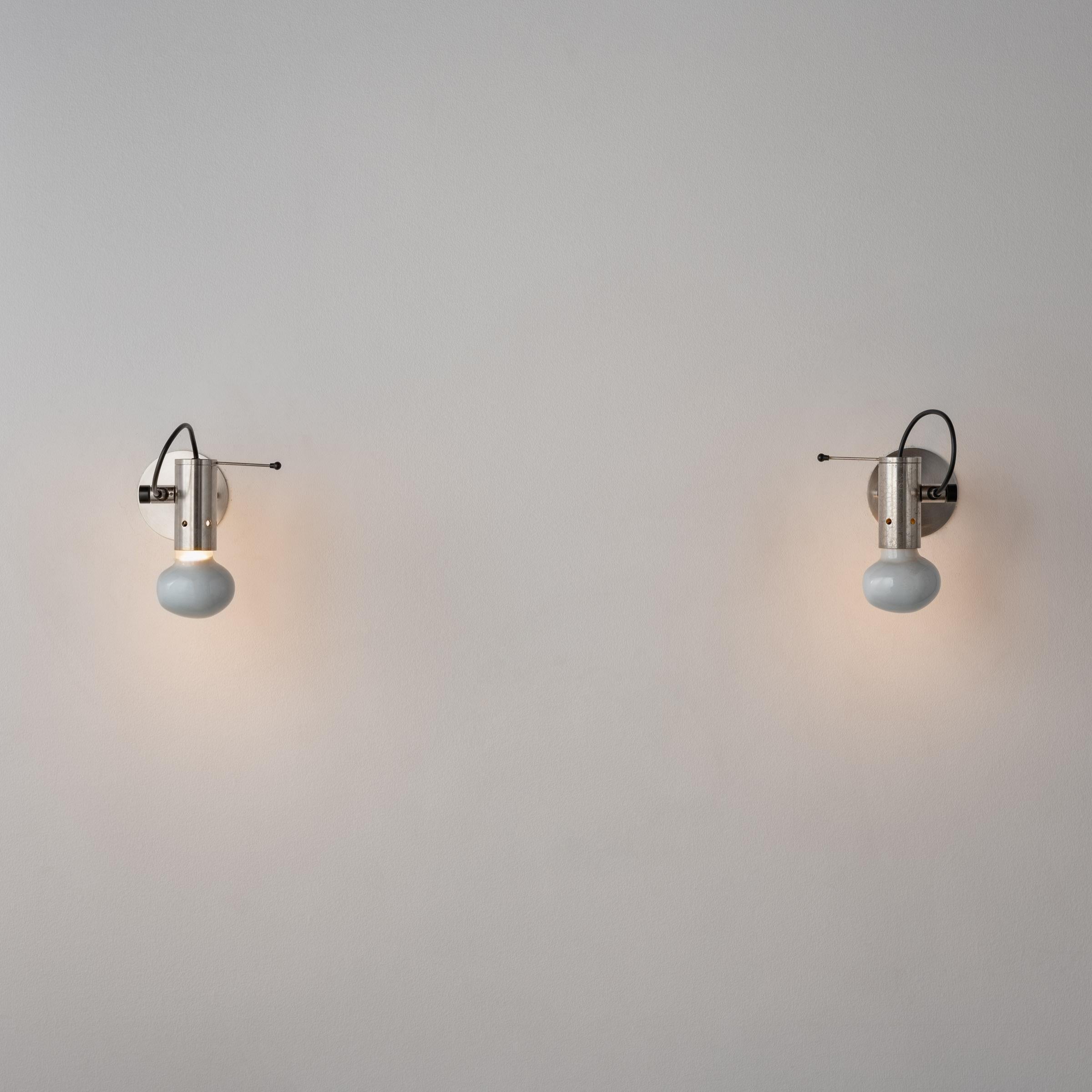 Mid-Century Modern Pair of Sconces by: Tito Agnoli for Oluce