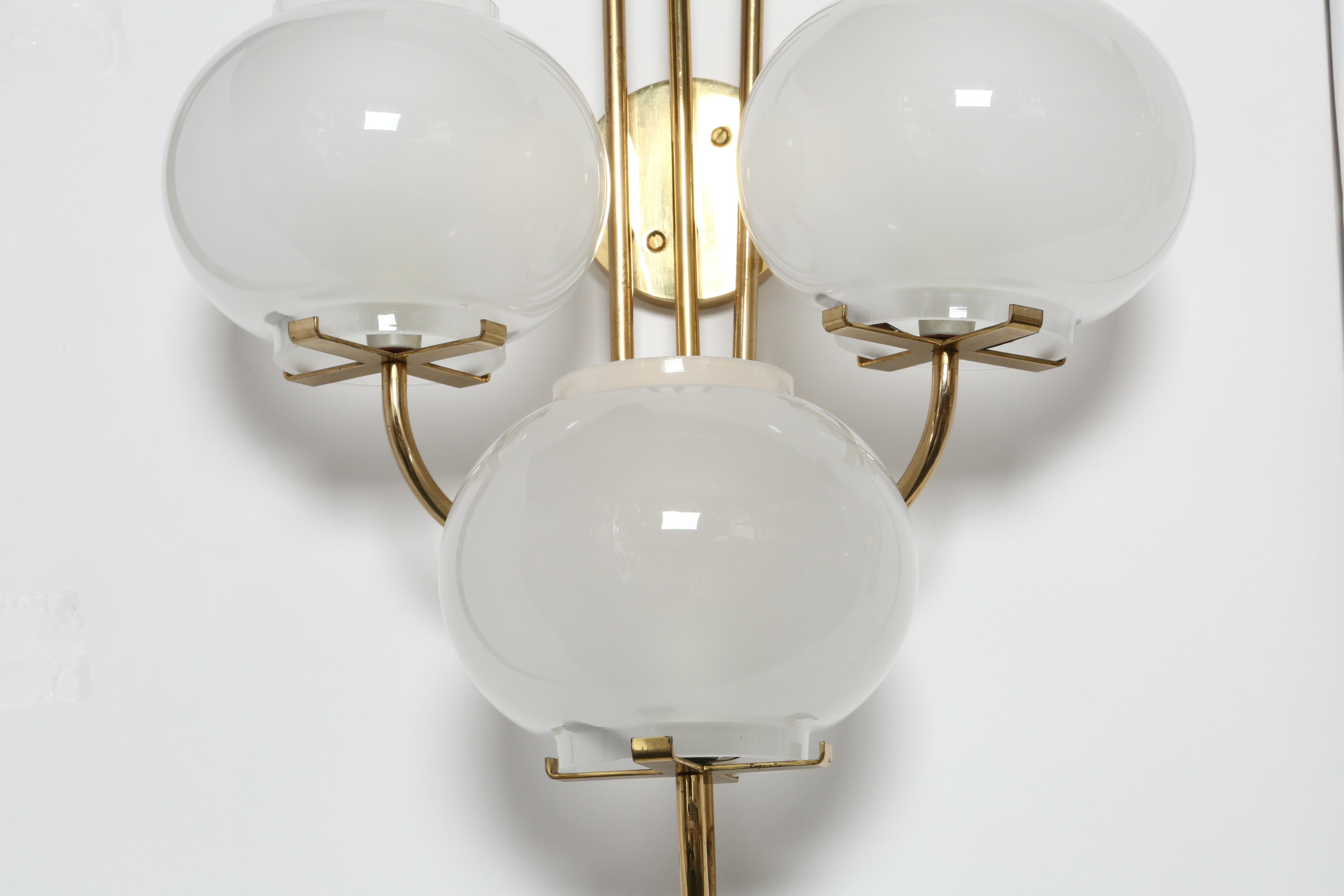 Brass Pair of sconces by Tito Agnoli for Oluce For Sale