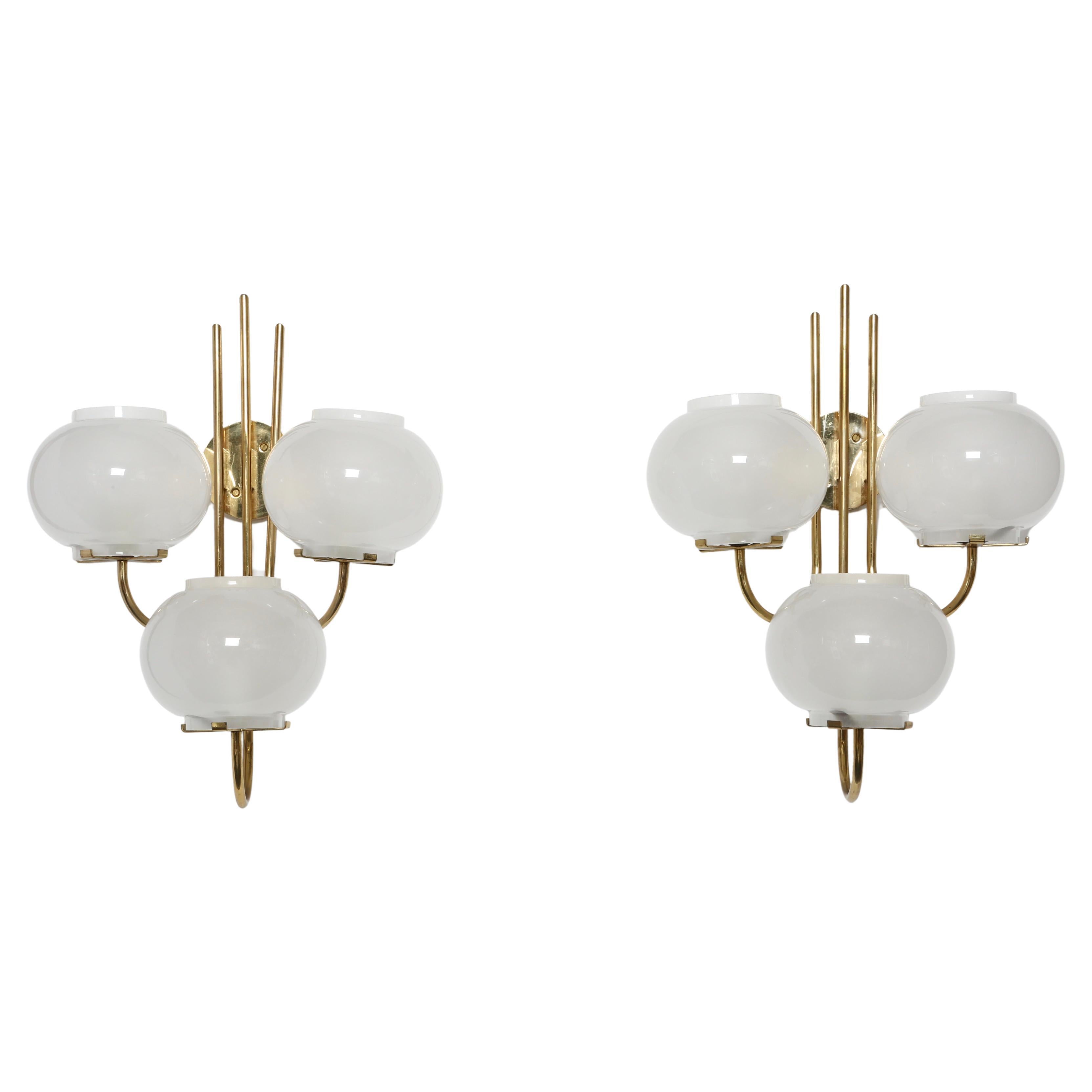 Pair of sconces by Tito Agnoli for Oluce